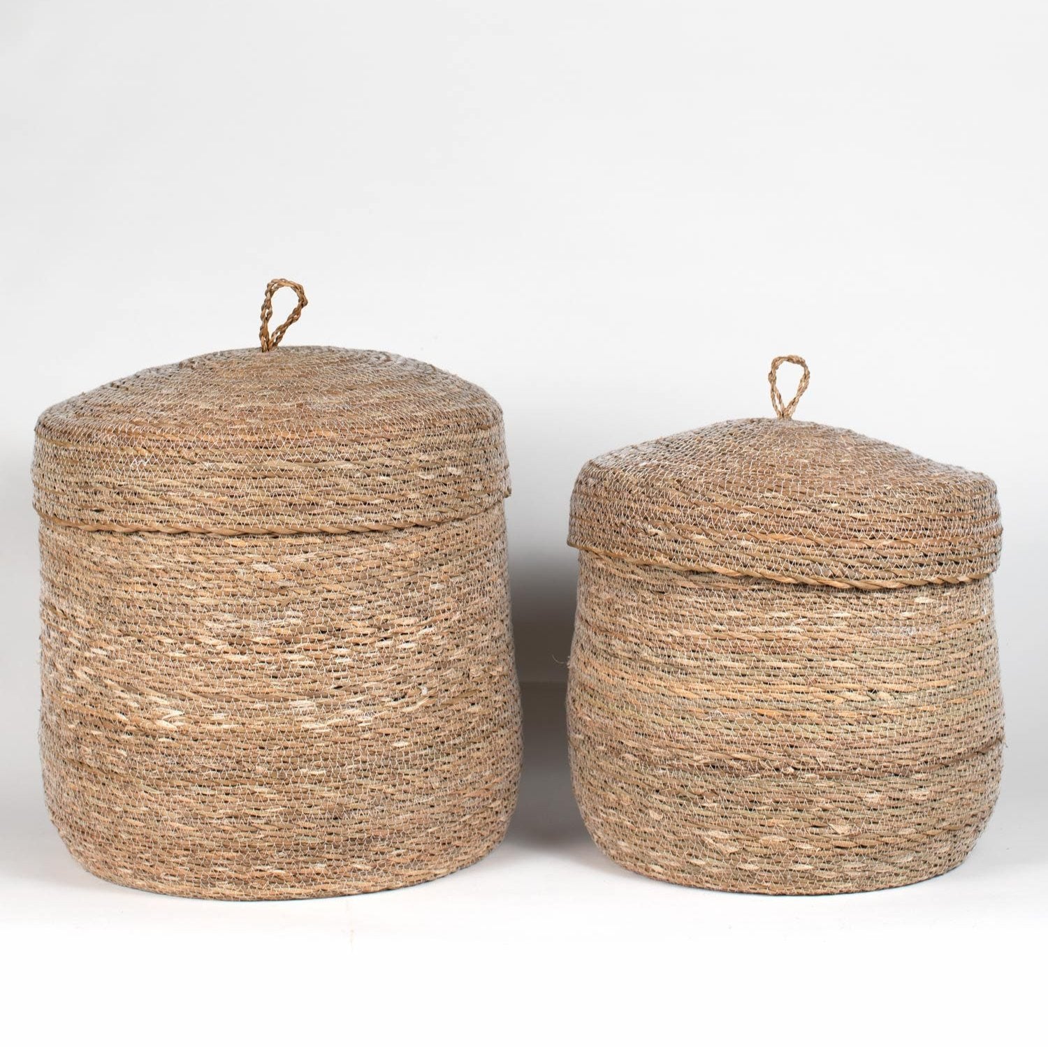 Elegant handwoven Hogla storage basket showcasing intricate weaving and a fitted lid.