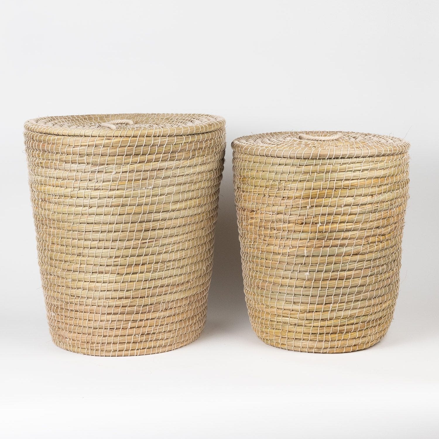 Close-up of handcrafted cotton hamper with woven handles for laundry and toys