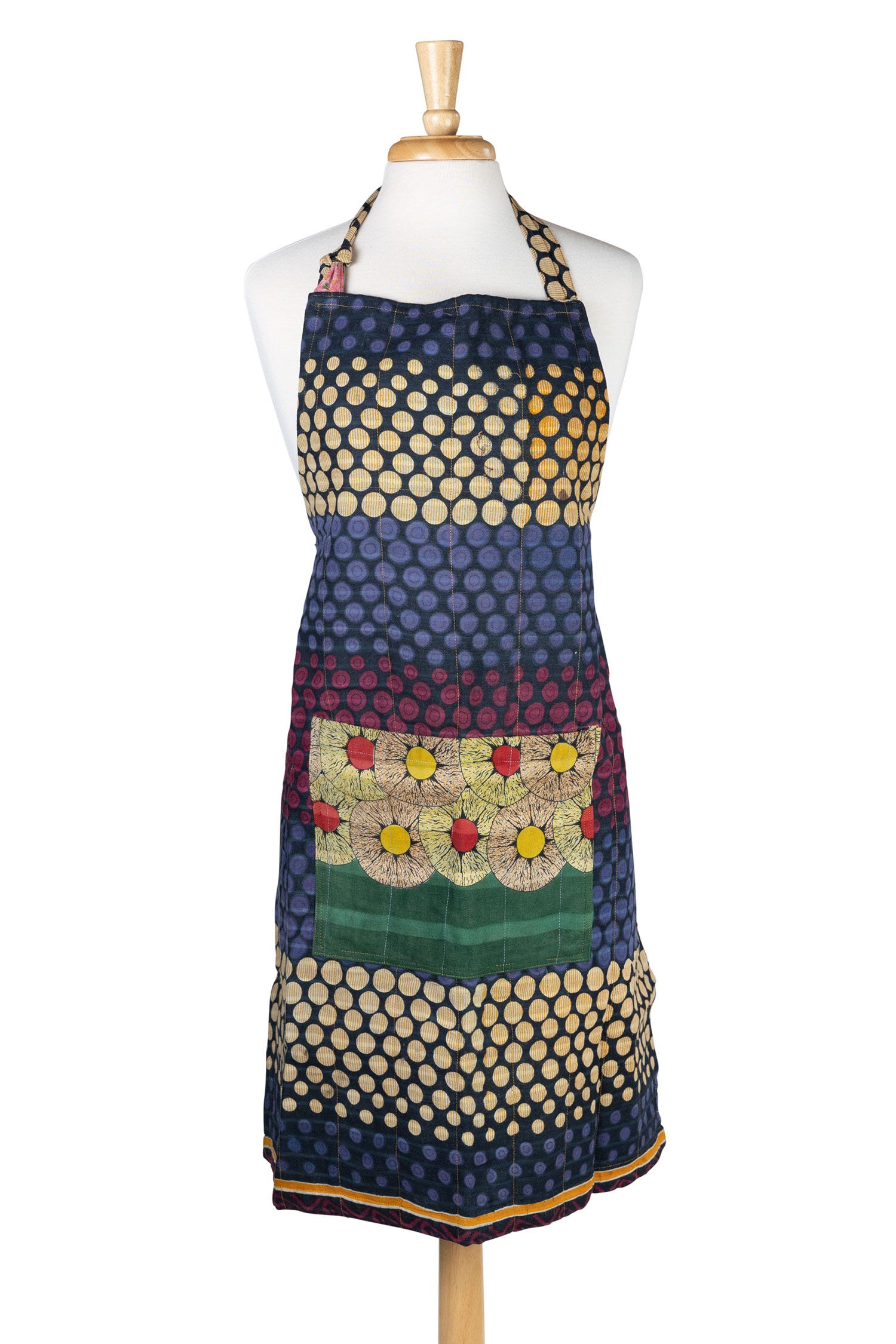 Front view of the reversible sari apron showcasing vibrant patterns made from recycled fabric.