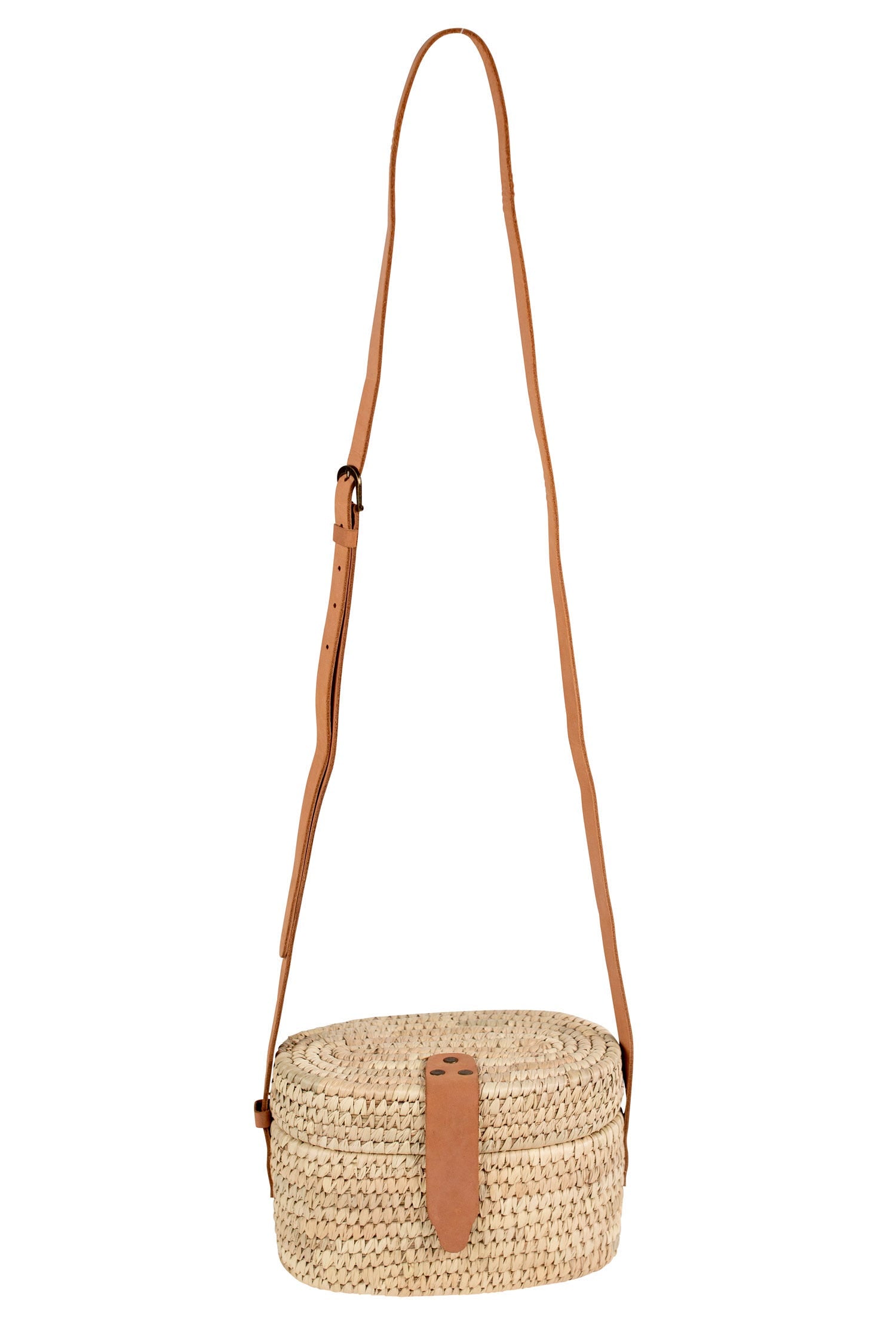Front view of the woven crossbody bag styled with casual outfit