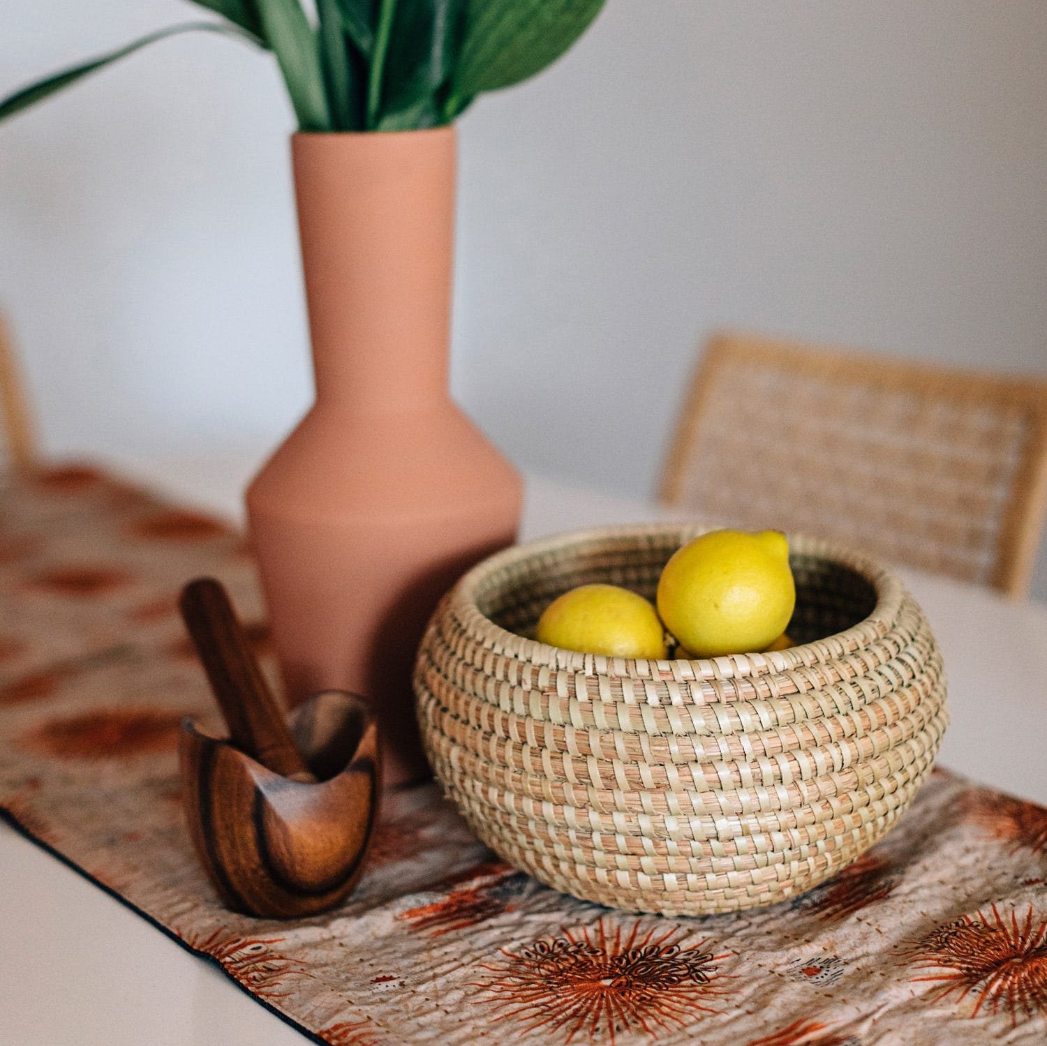 Close-up of handmade woven basket bowl with natural Kaisa grass texture, ideal for bread and snacks