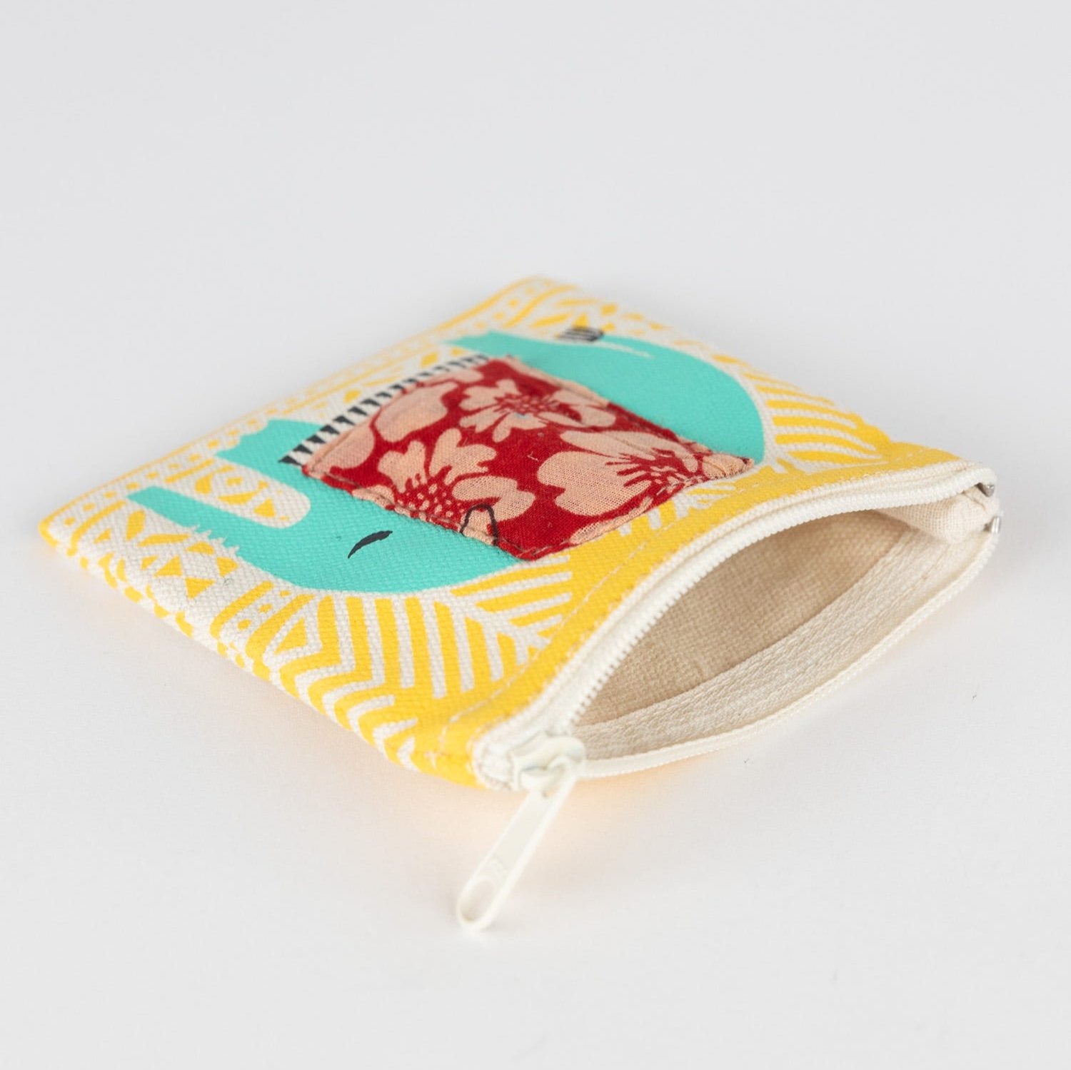 Handcrafted coin purse with blue elephant design, perfect for travel and daily use