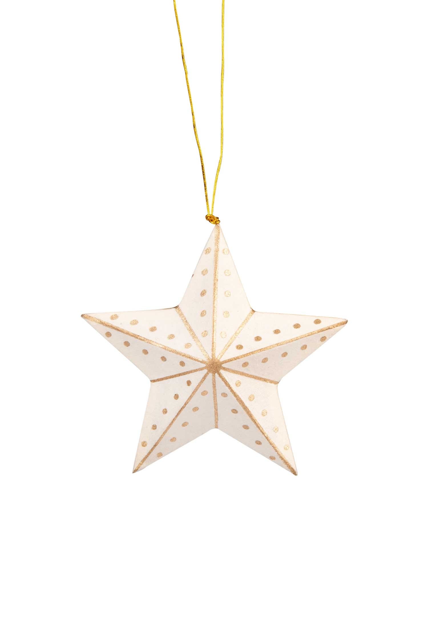 Elegant gold and white star ornament hanging on a Christmas tree.
