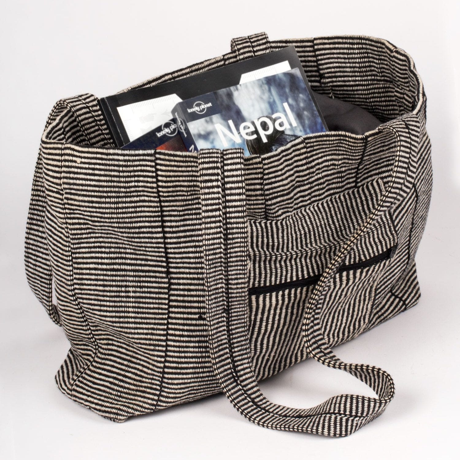 Cotton travel tote bag with beach essentials inside