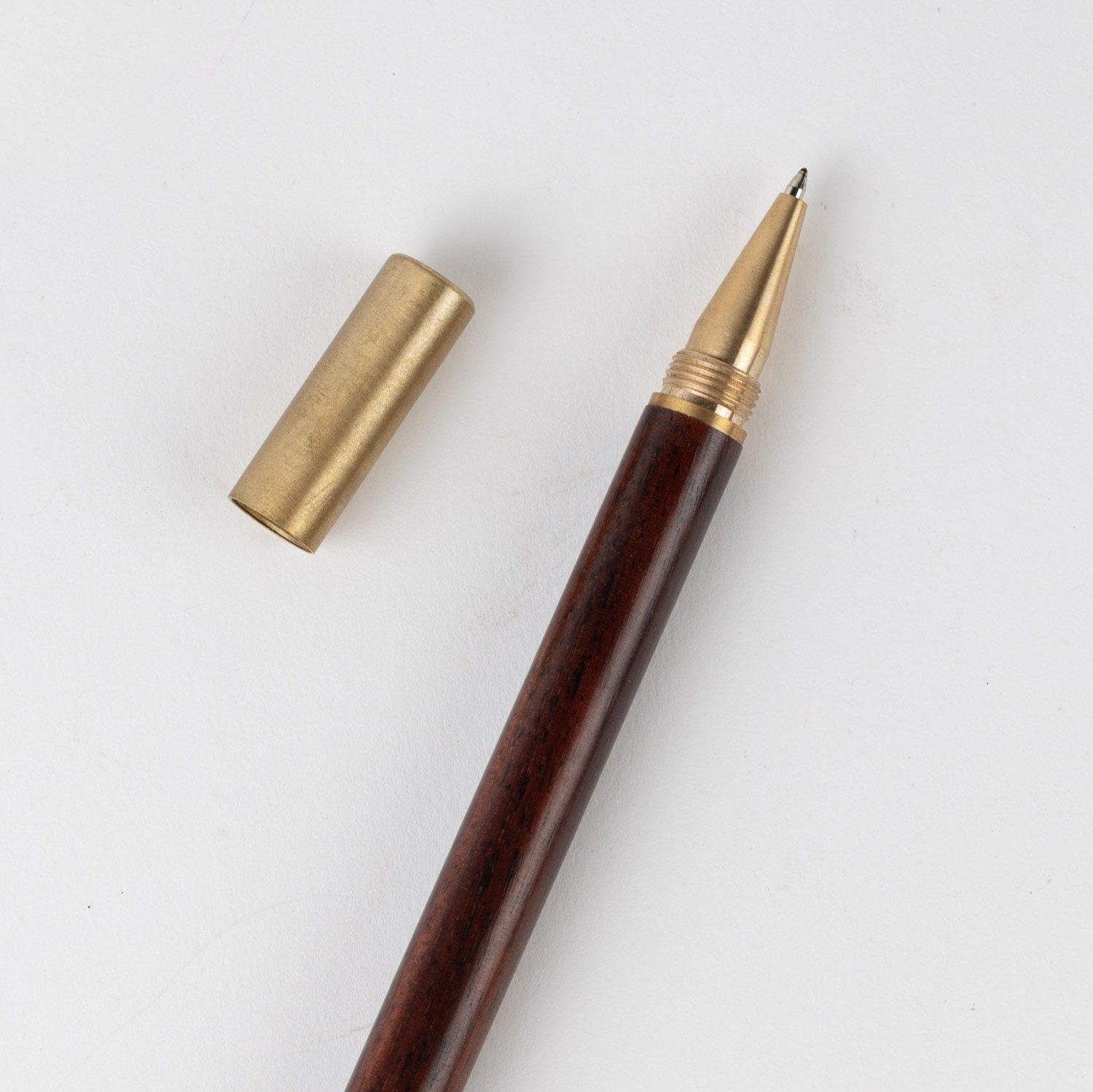 Artisan Sheesham Wood Gift Pen showcasing its unique grain and craftsmanship.