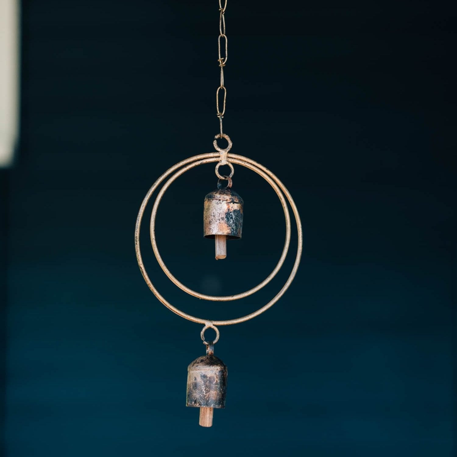 Close-up of handcrafted wind chime with intricate details for outdoor decor
