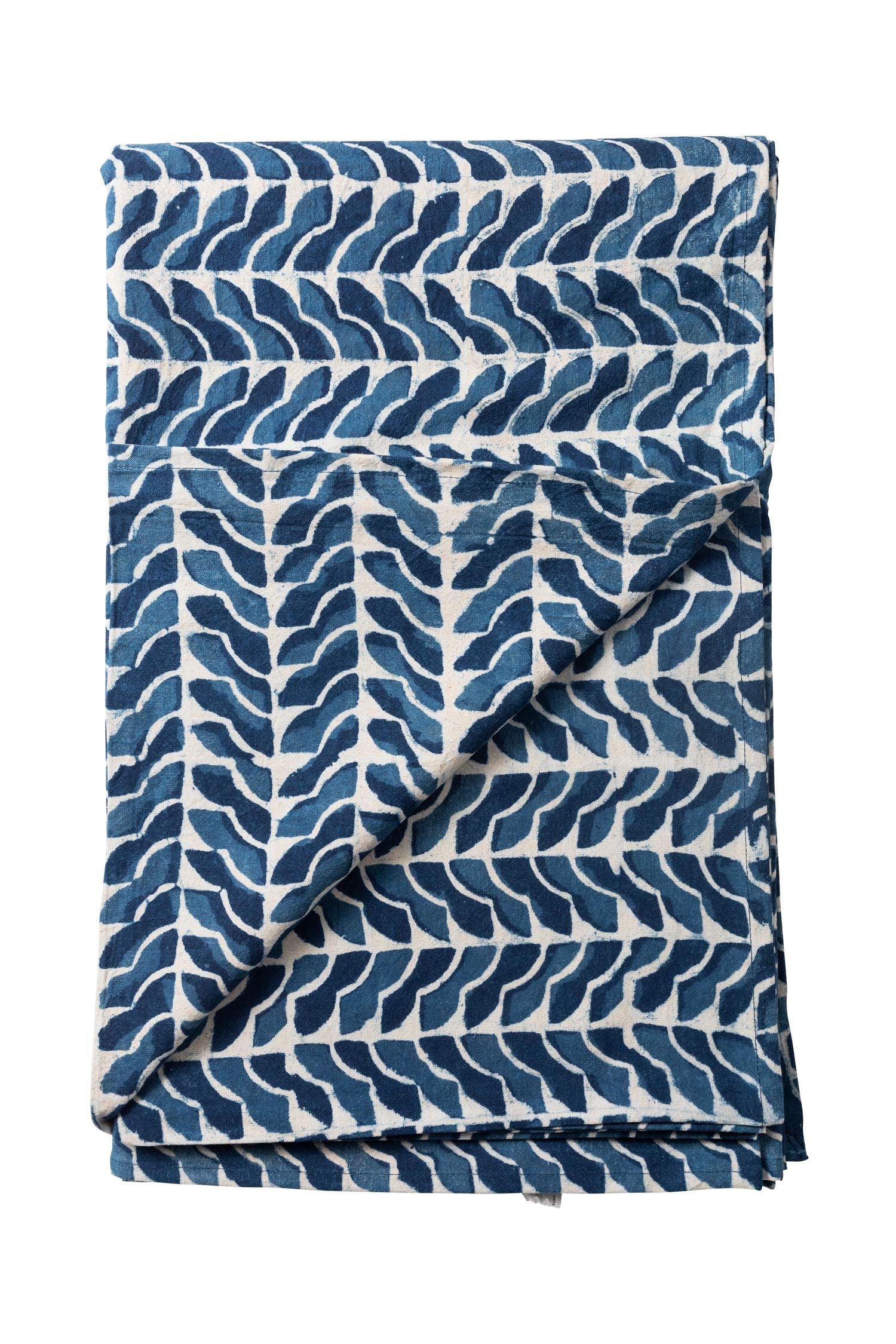 Overhead view of Sea Breeze handprinted tablecloth on a dining table set for four