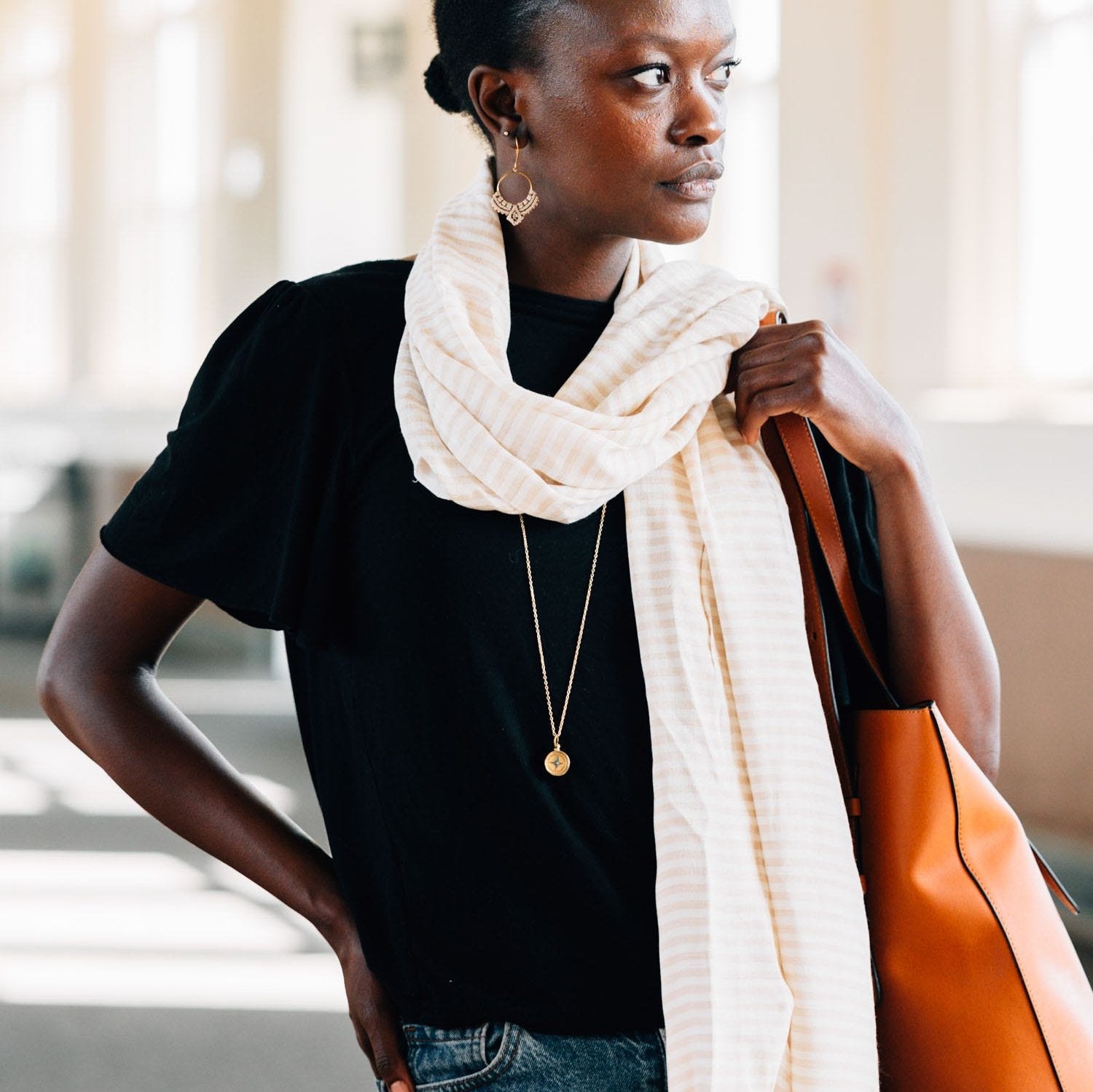 Elegant bamboo striped scarf displayed on a wooden table, showcasing its texture and design.