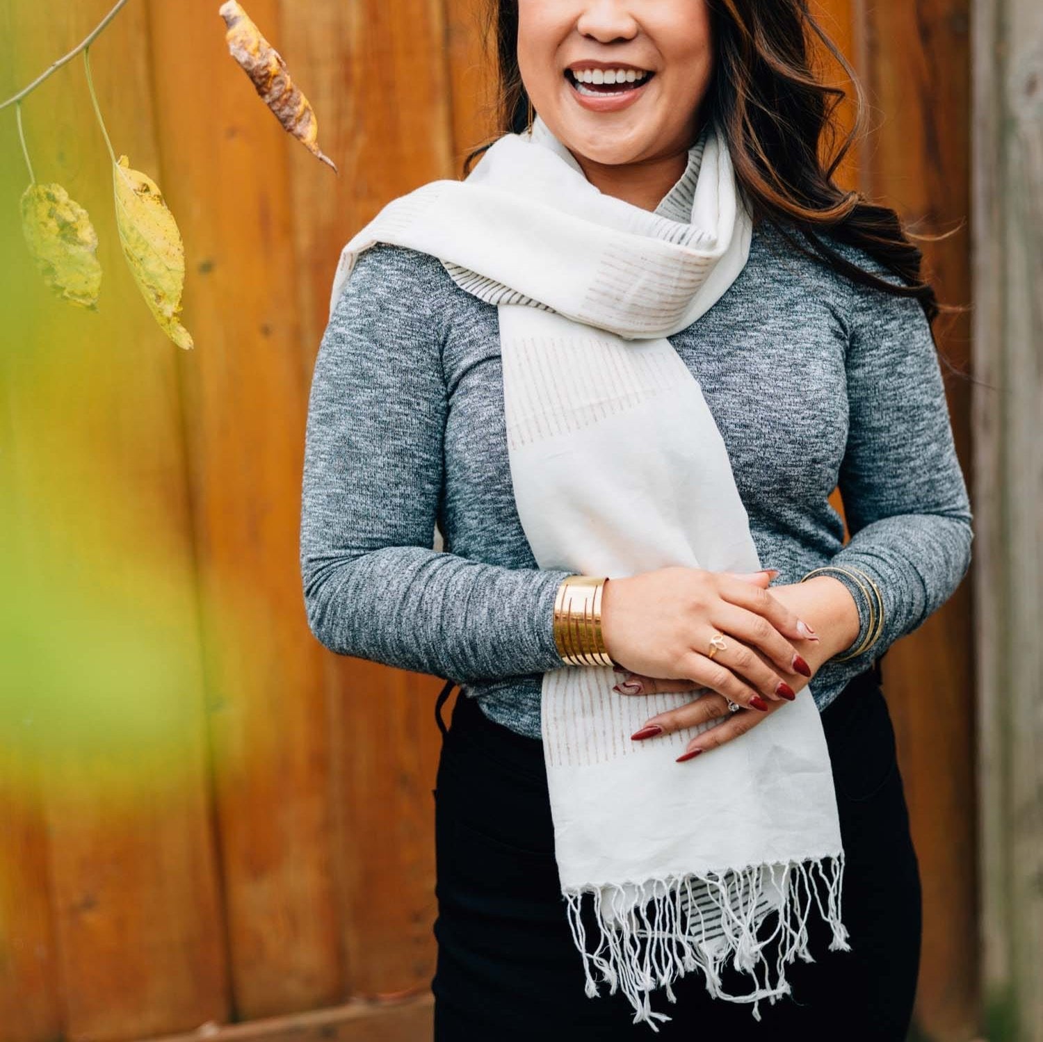 Wheatfields cotton scarf showcasing its elegant stripe design and fringe detail, perfect for winter wear.
