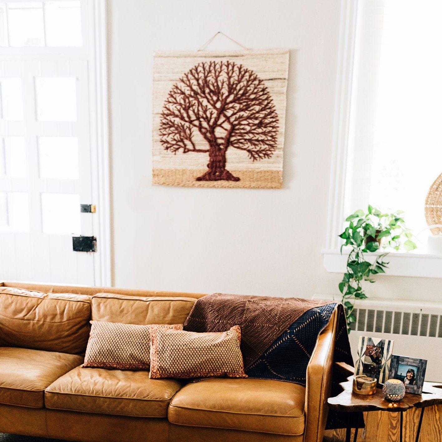 Close-up of overlapping wool branches in the handcrafted tree of life wall hanging