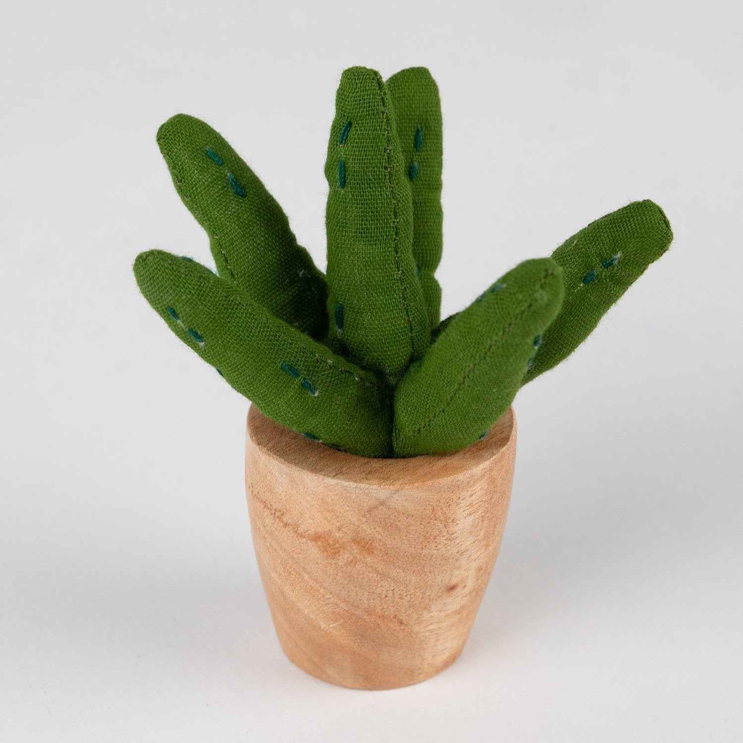 Handmade mini aloe vera plant with eco friendly cotton succulent decor on a desk
