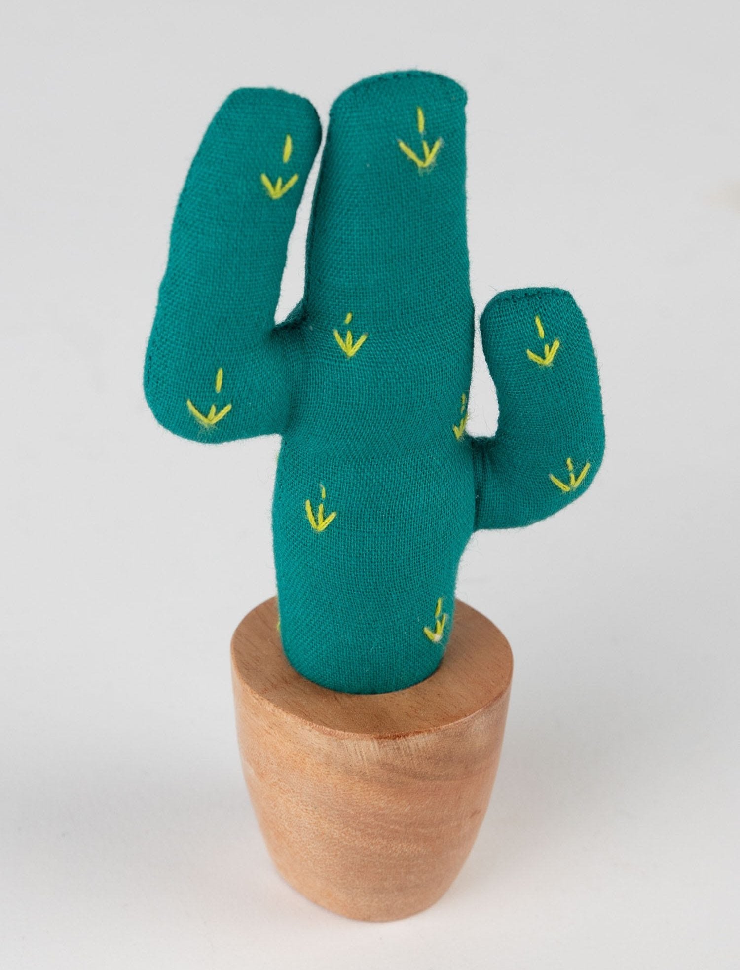 Close-up of a handmade mini saguaro cactus on a desk