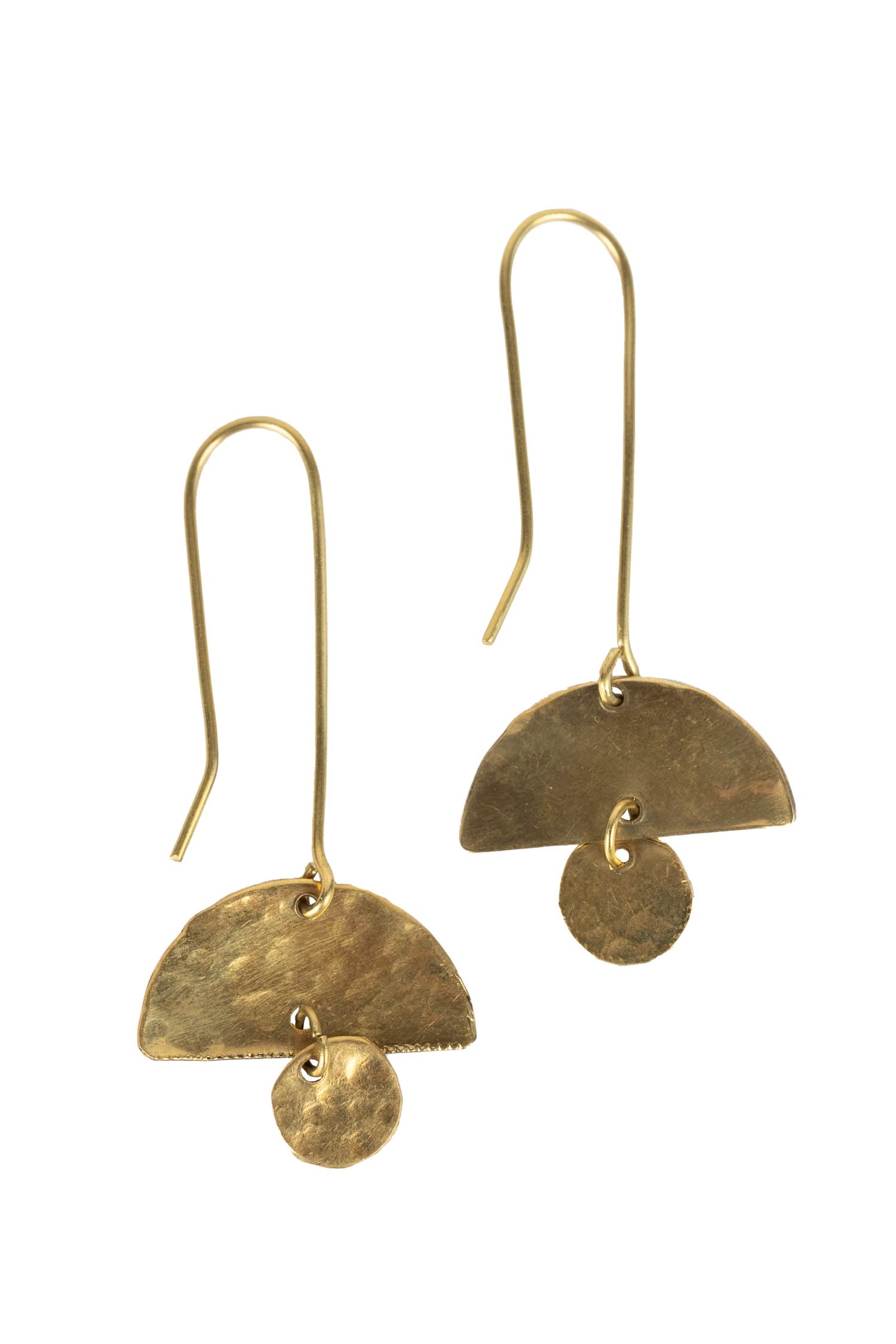 Close-up of handcrafted half-moon dangling earrings showcasing detailed artisan work