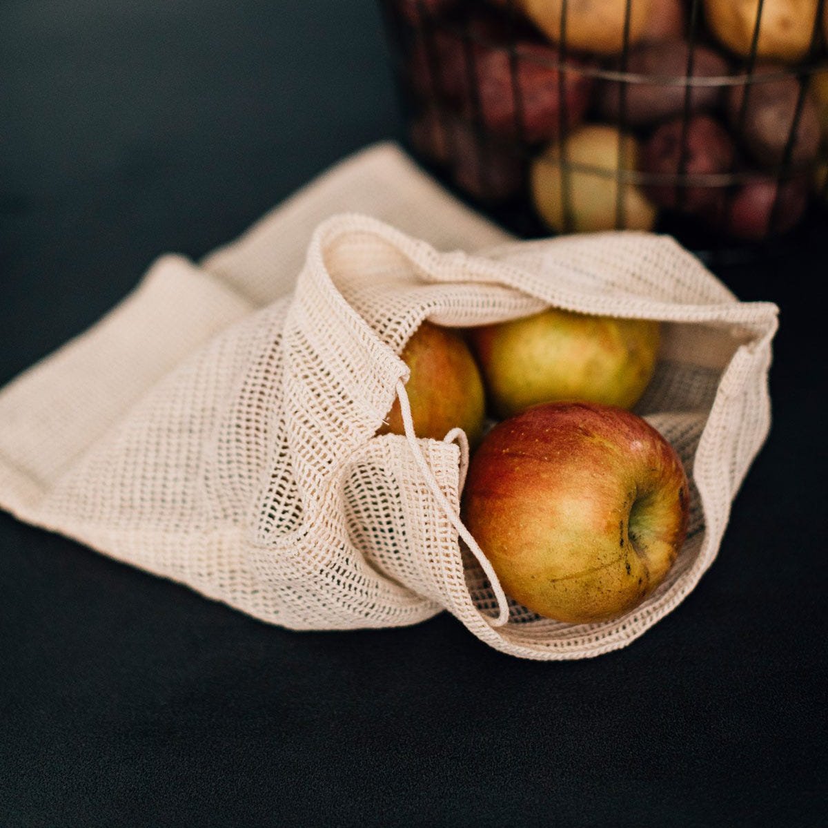 Handmade cotton eco bag filled with fresh groceries, perfect for daily use.