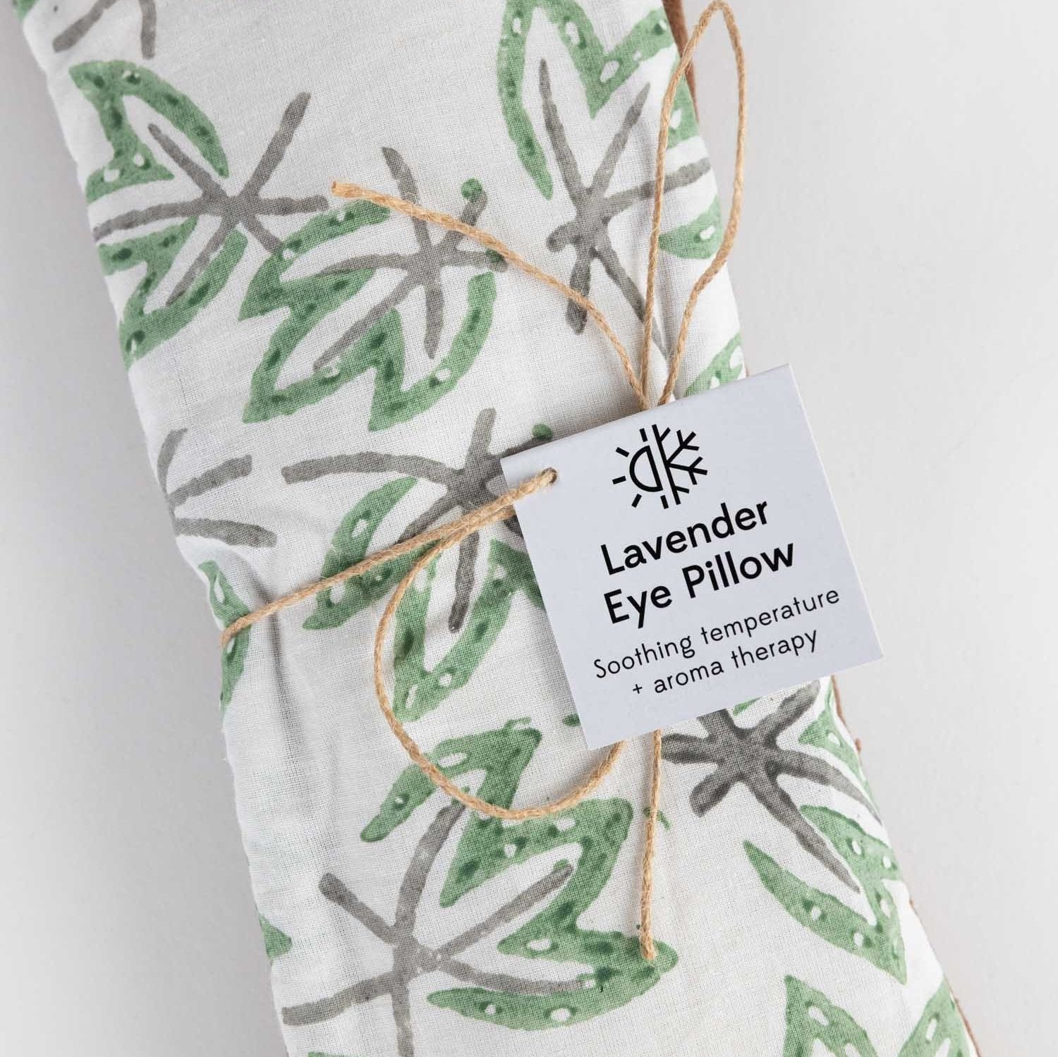 Relaxation Bliss Warming Eye Pillow resting on a soft blanket, showcasing its calming design.