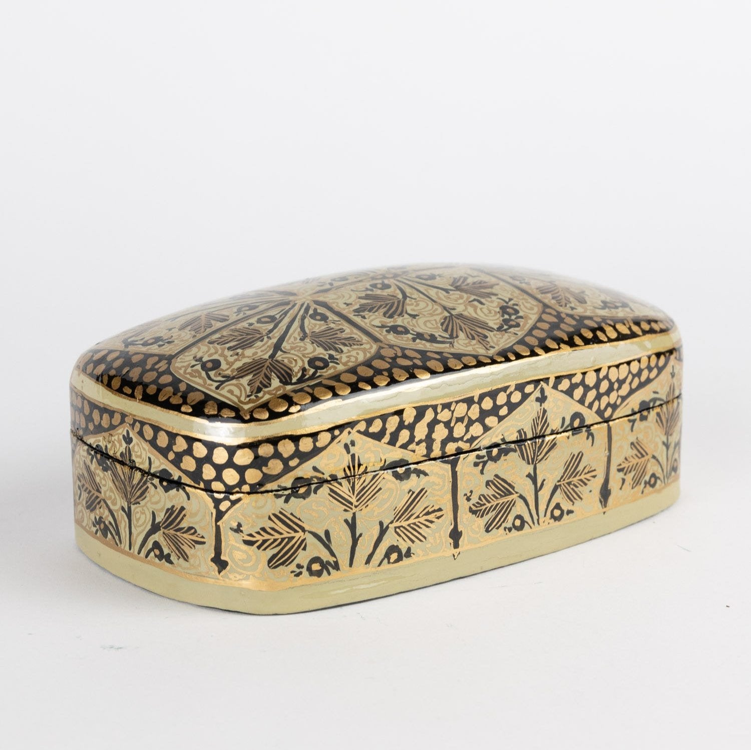 Artisan leaf motif jewelry box with vibrant colors and intricate design, perfect for displaying keepsakes.