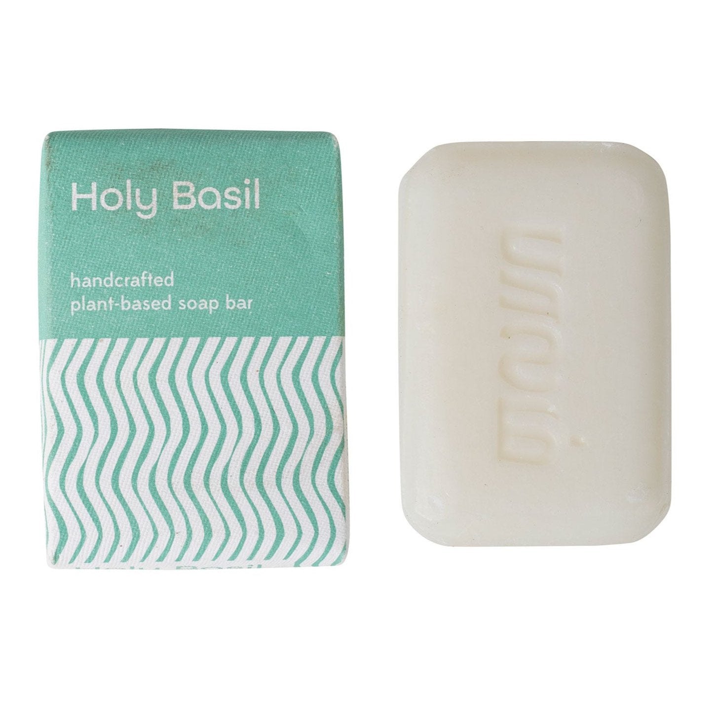 Close-up of holy basil soap bar showing smooth texture and herbal ingredients