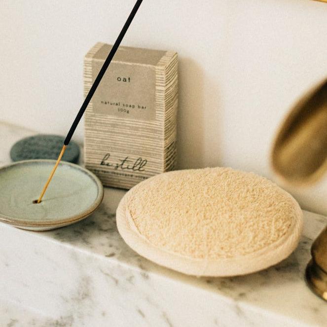 Eco-friendly body scrubber made from natural sisal fiber, showing textured surface and sustainable design.