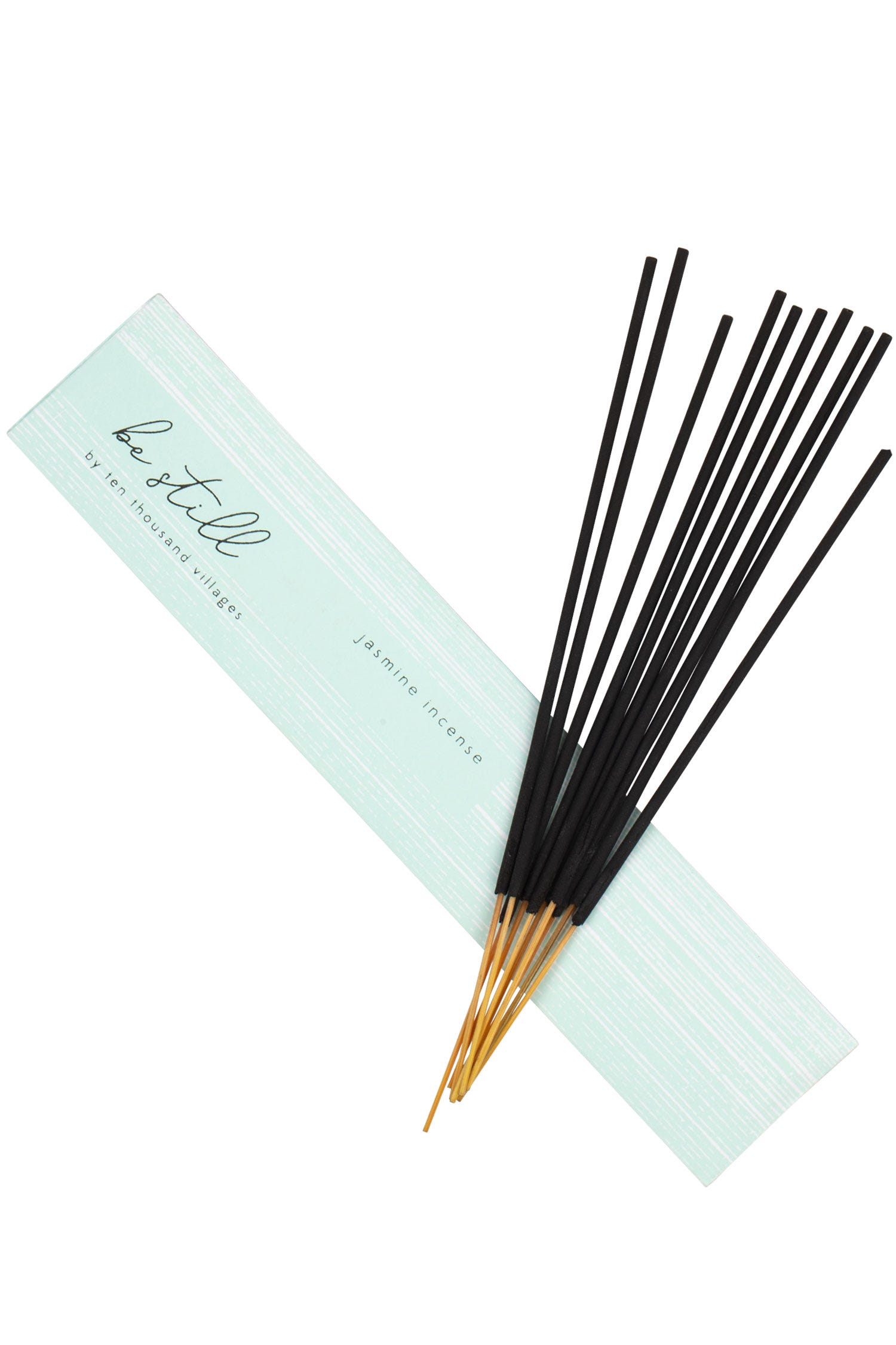 Close-up of jasmine incense sticks arranged elegantly in a ceramic holder
