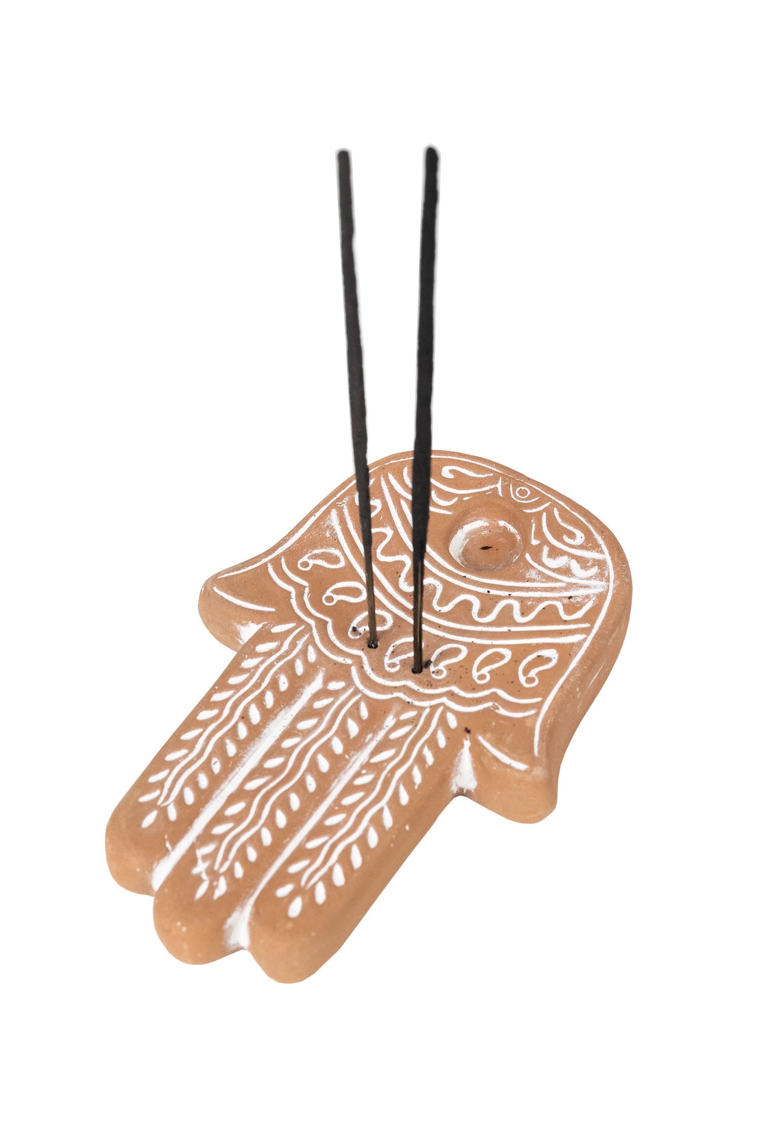 Side view of the handcrafted terracotta Hamsa incense holder with white designs, perfect for meditation