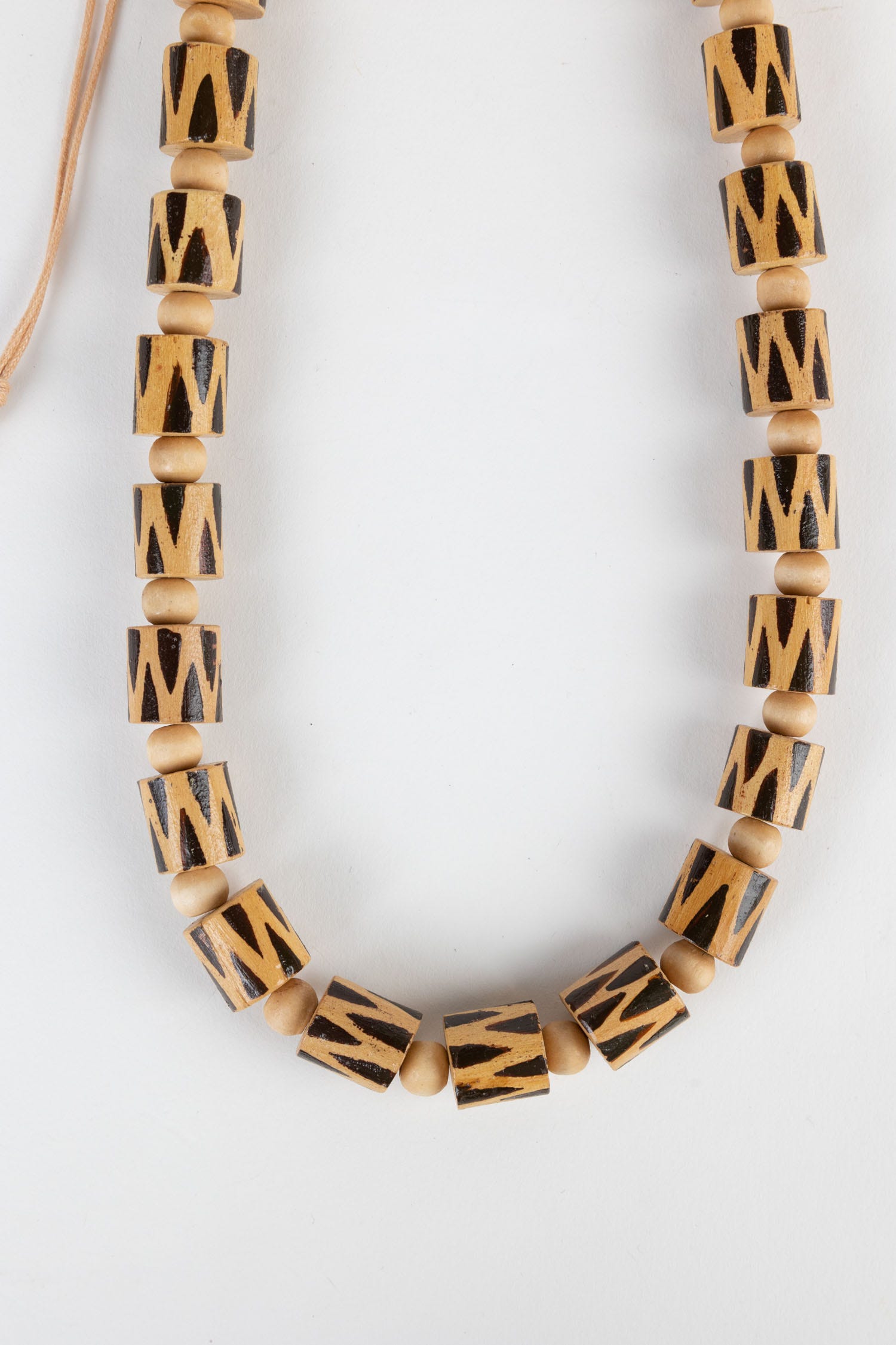 Front view of a handcrafted wooden barrel bead necklace, perfect for casual or beach wear.