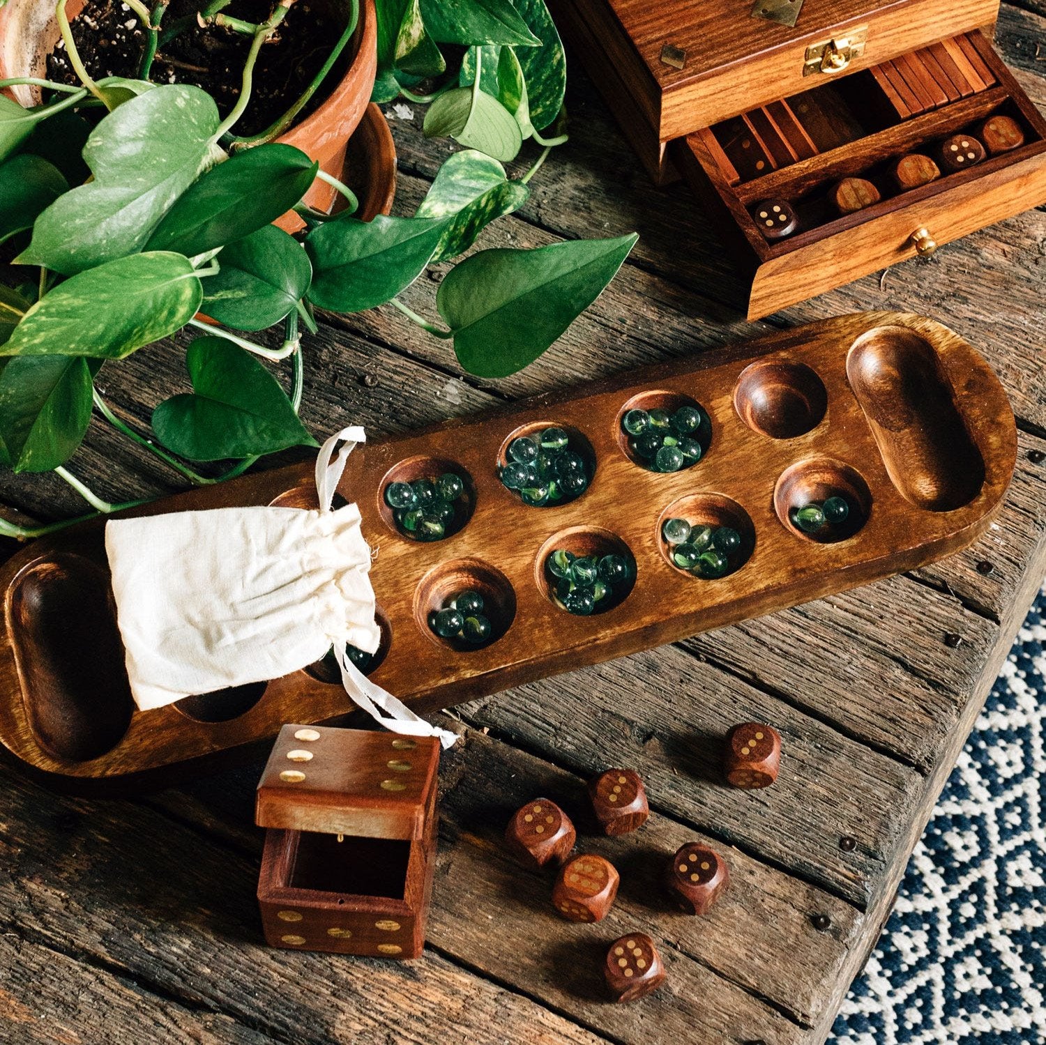 Artisan mango wood Mancala board game showcasing intricate craftsmanship