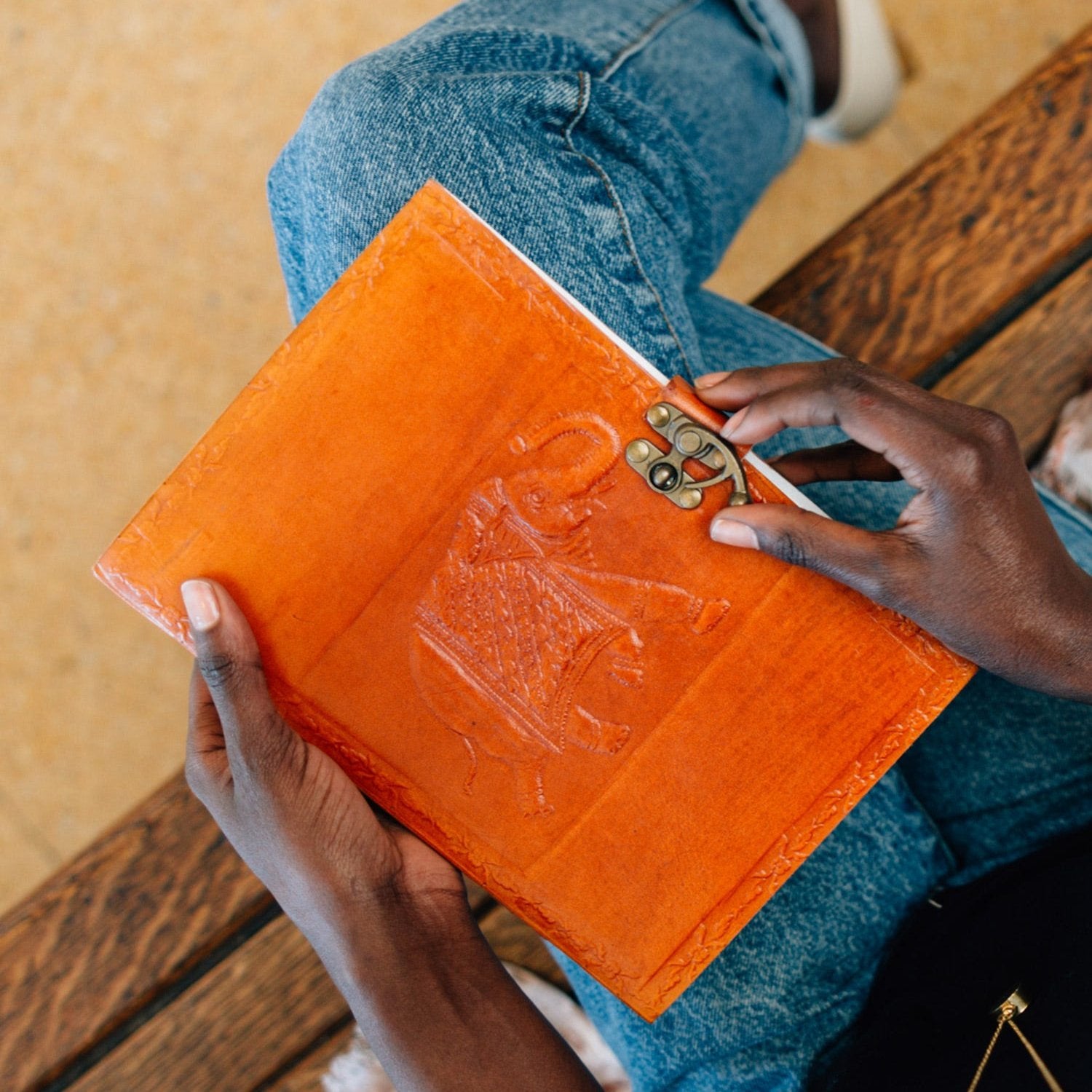 Leather elephant journal with embossed elephant and mandala design from a front angle