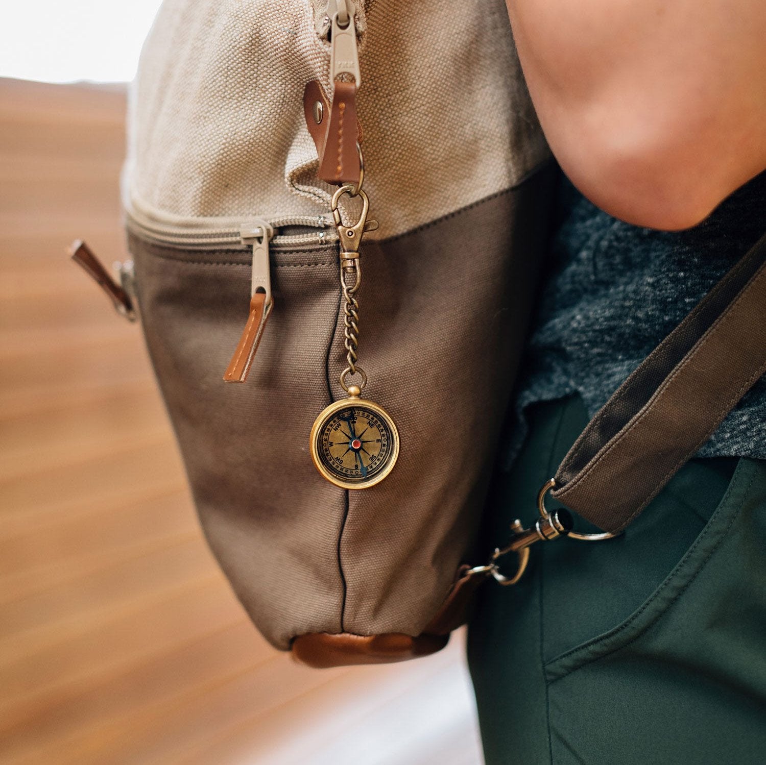 Personalized compass key chain with engraving, showcasing its detailed craftsmanship.