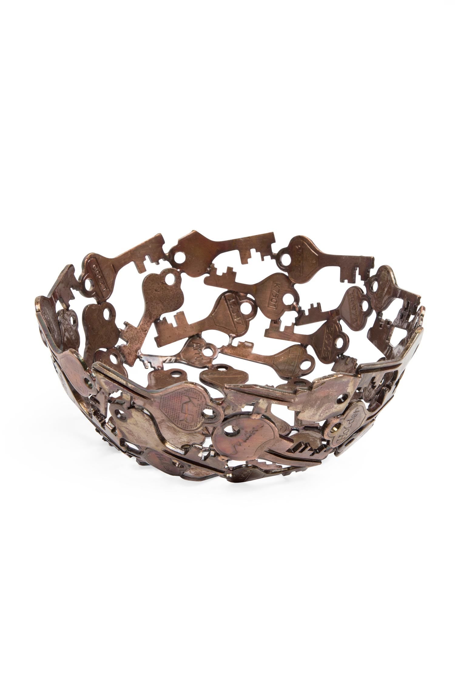 Elegant handcrafted key bowl displayed on an entryway table, holding keys and small items.