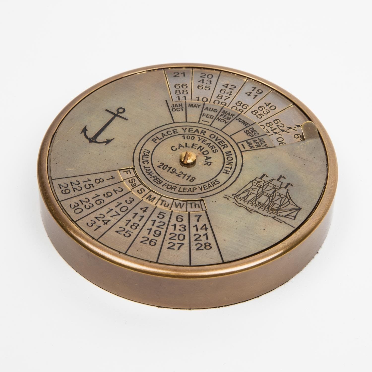 Antique brass 100-year desk calendar with detailed craftsmanship.