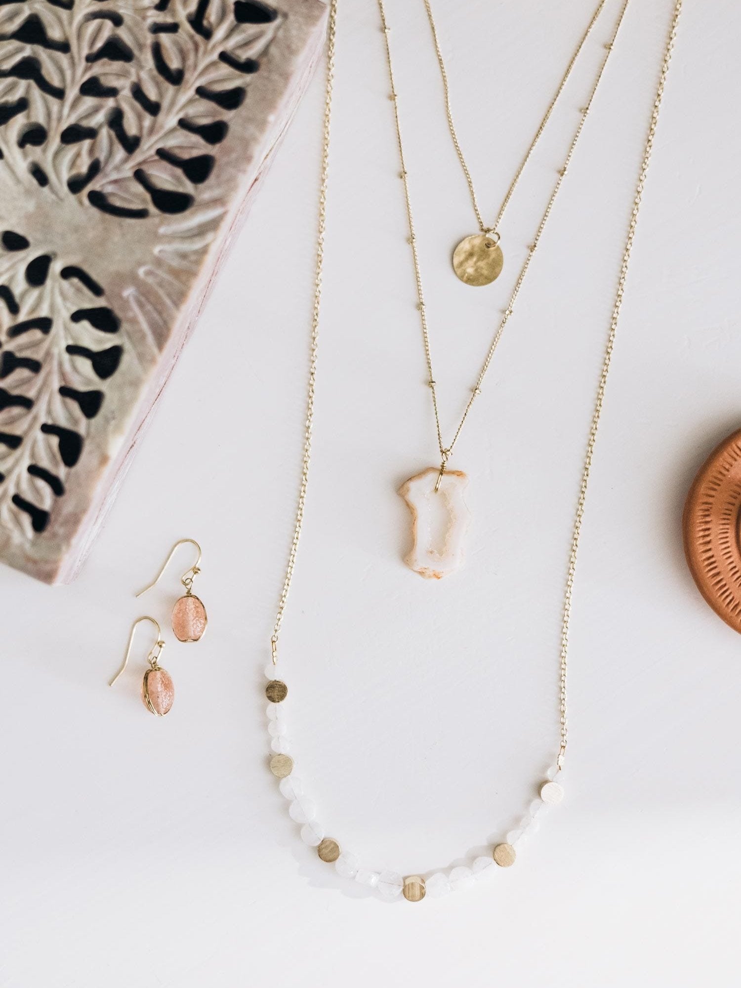 Close-up of the Moonstone & Druzy Gold Layered Necklace highlighting the intricate details of the druzy pendant.