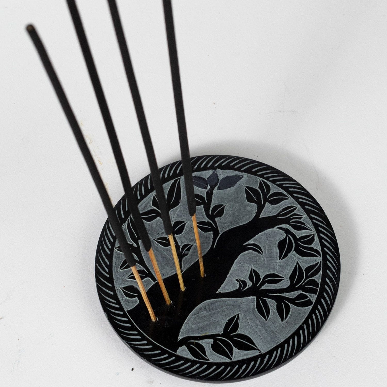 Handcrafted Tree of Life incense holder showcasing its intricate design and ash-catching feature.