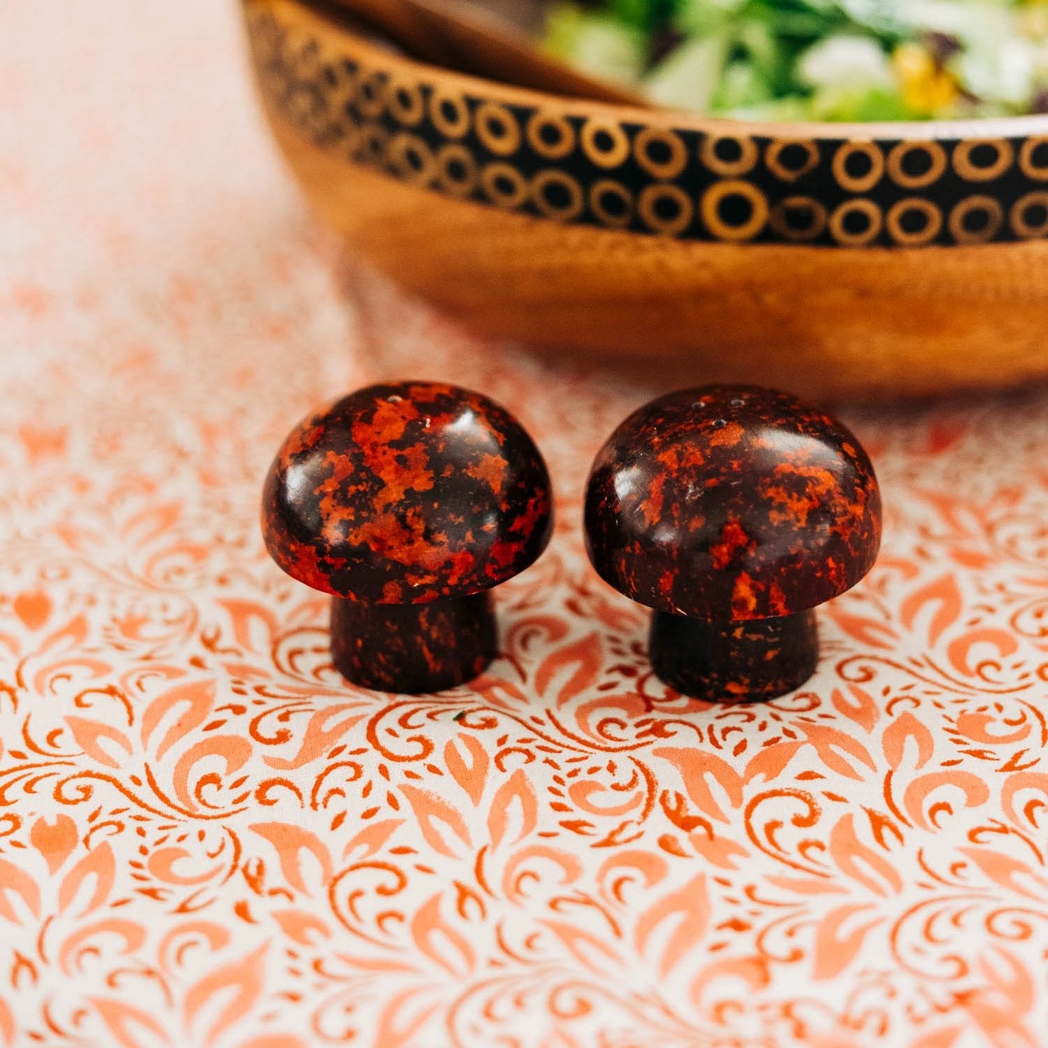 Close-up of the handcarved mushroom salt and pepper shakers showcasing their unique design.