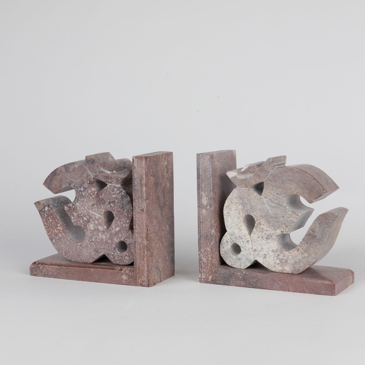 Handcrafted Agra stone bookends with intricate Om symbol design, perfect for showcasing books.