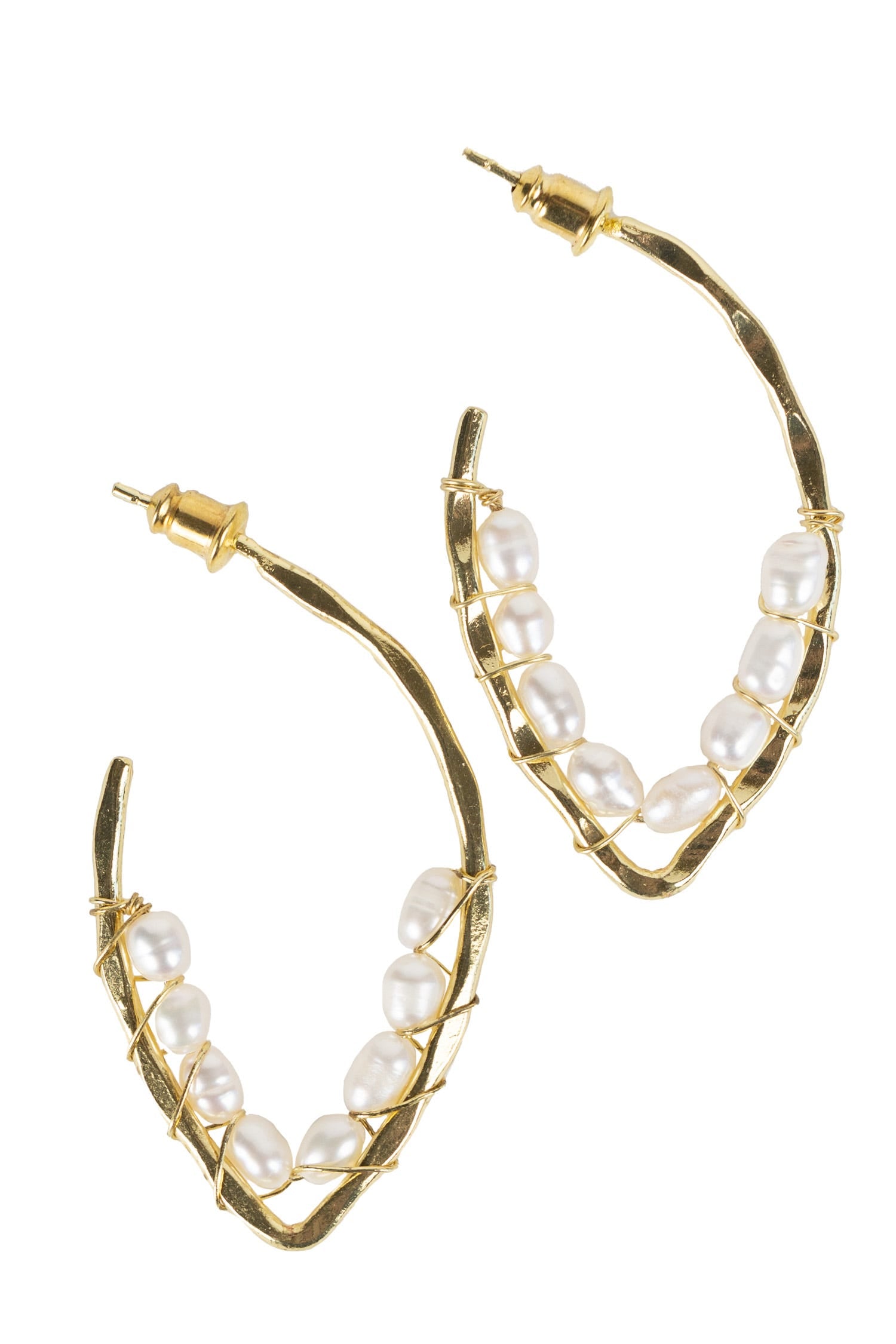 Close-up view of elegant loop earrings adorned with pearls