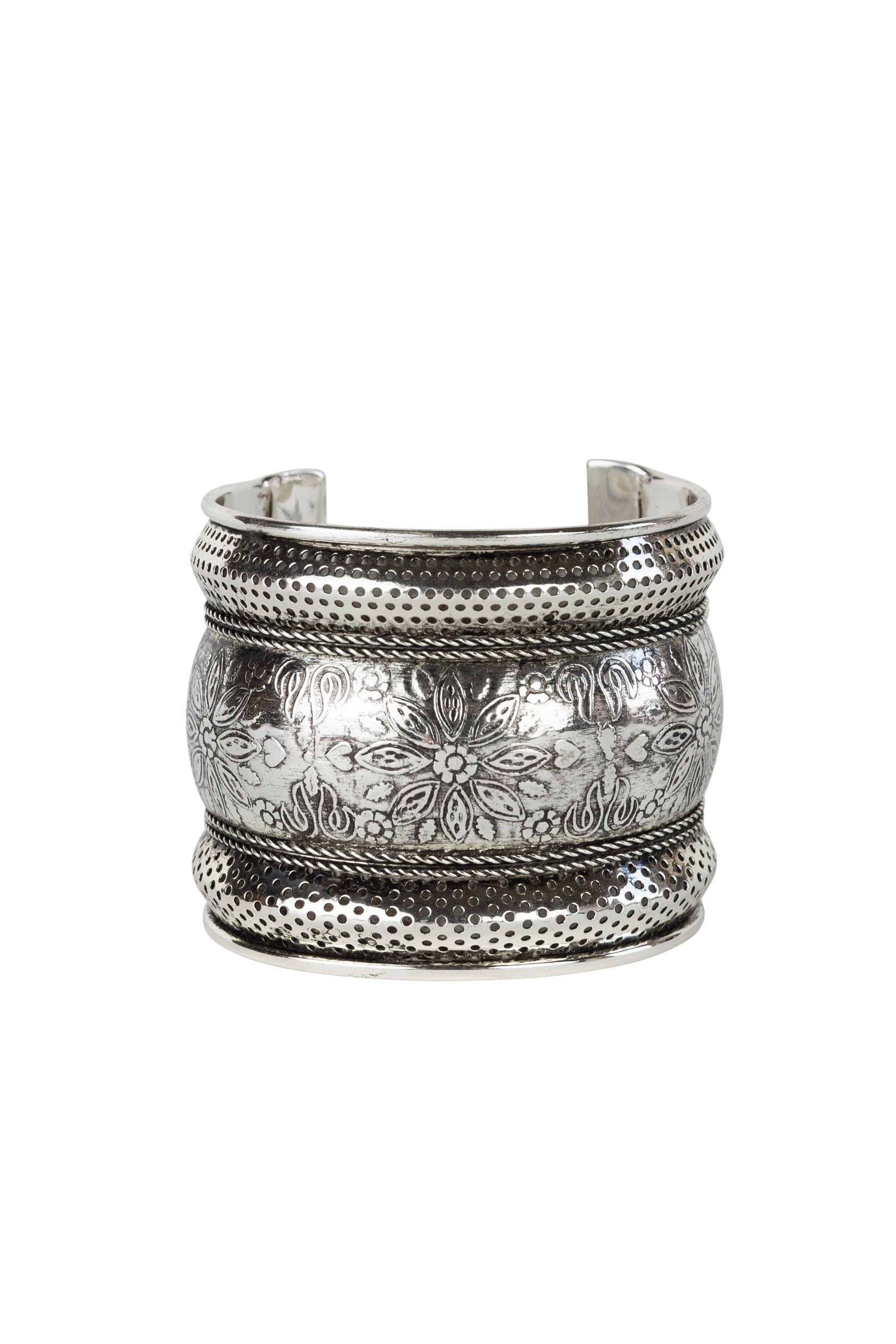 Elegant floral silver cuff bracelet showcasing detailed embossing from multiple angles.