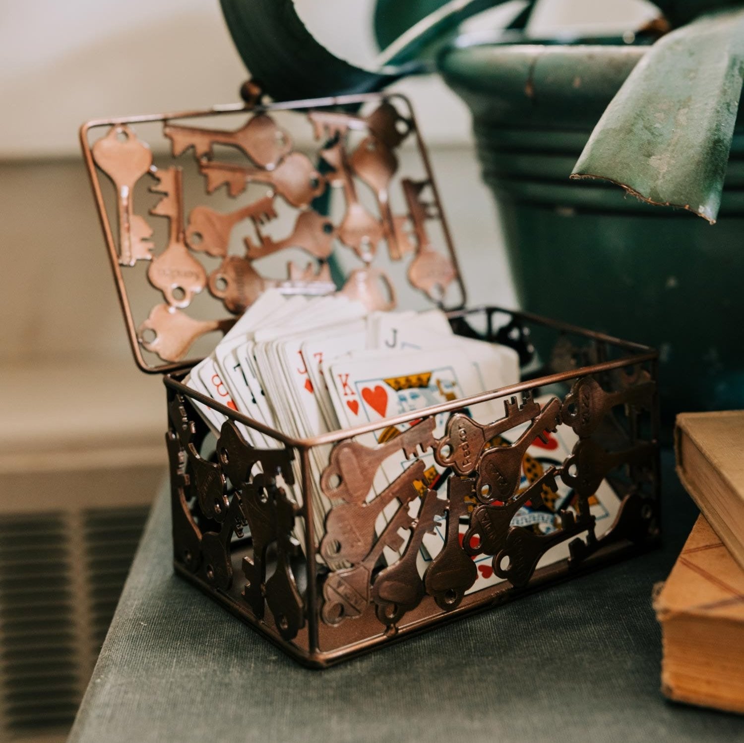 Handcrafted recycled iron key storage box with keys inside, eco-friendly design.