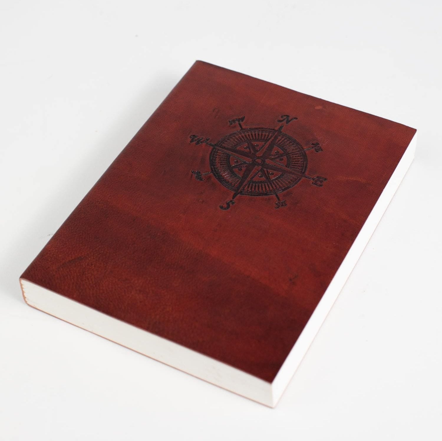 View of the Compass Craft Leather Journal with embossed compass design, showcasing its premium buffalo leather texture.