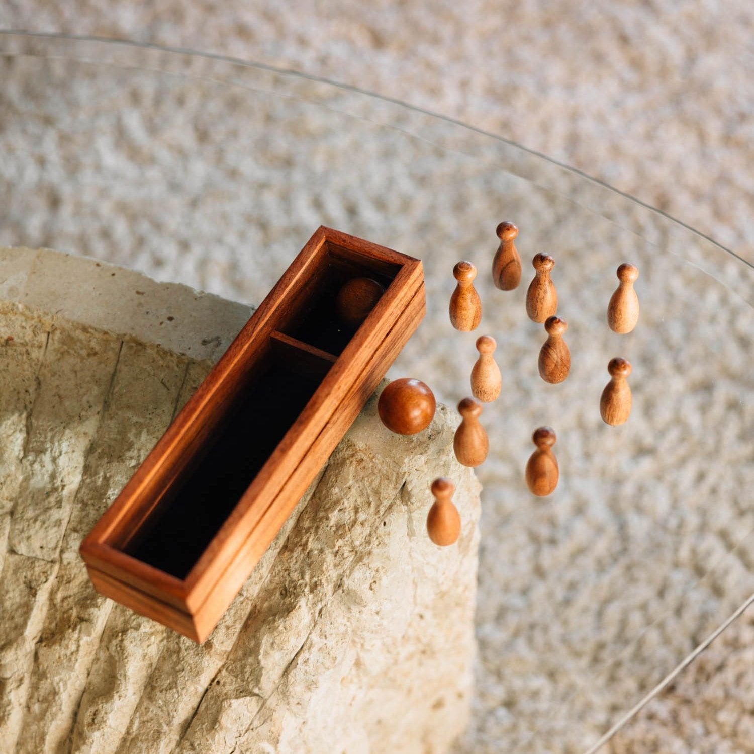 Artisan mini bowling set on a table, ready for family fun