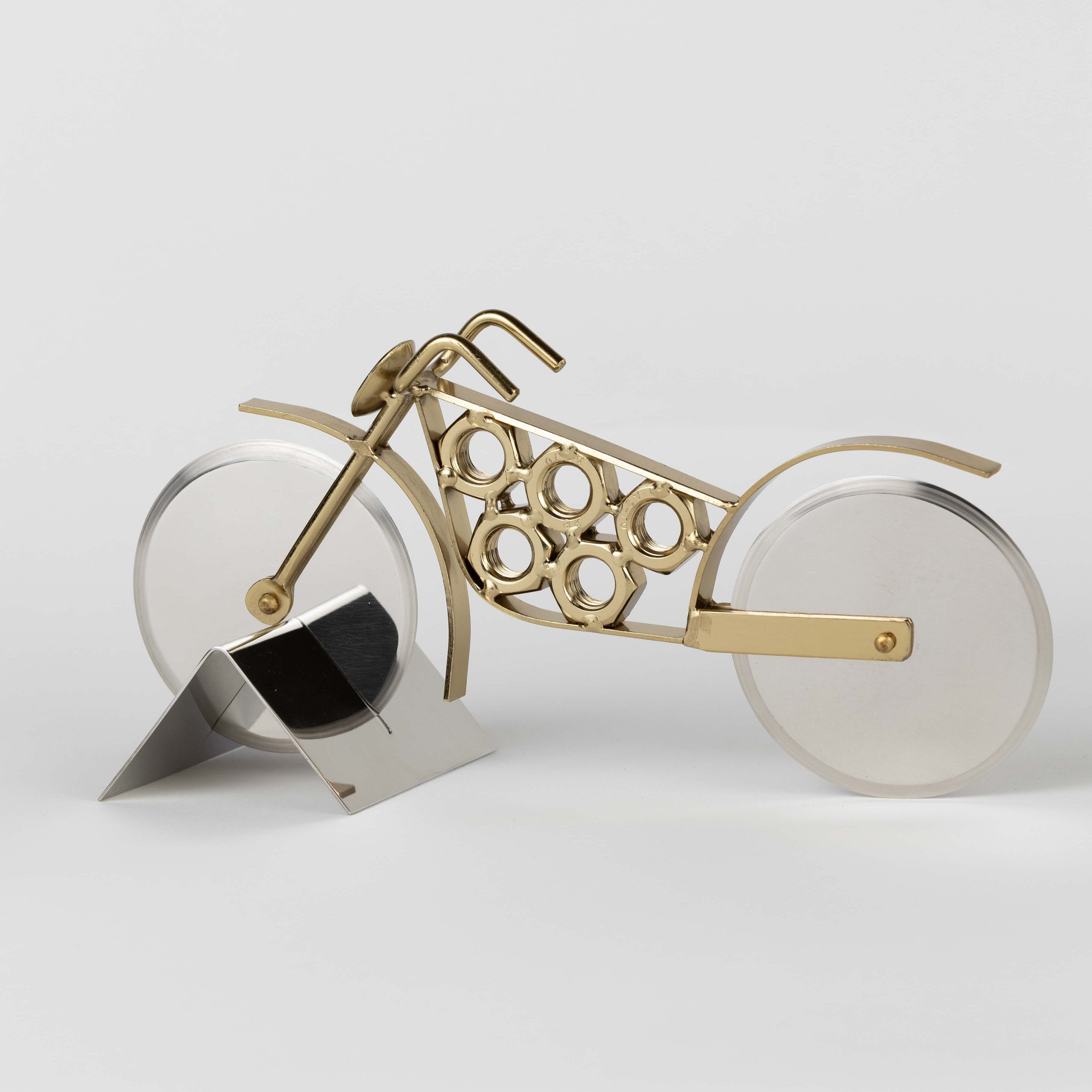Close-up of the revved-up motorcycle pizza cutter showcasing its intricate design.