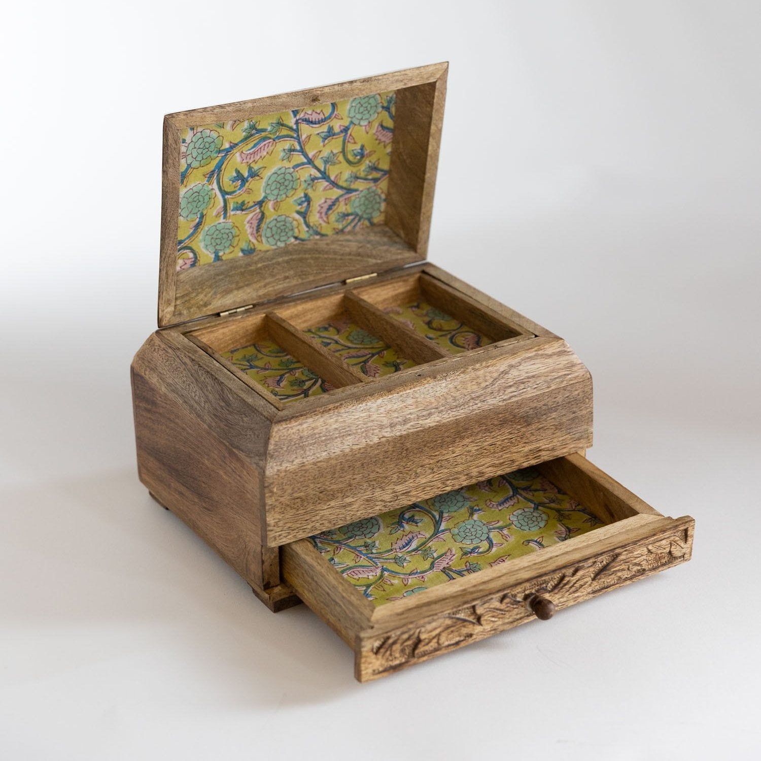 Close-up of handcarved mango wood jewelry box with intricate details