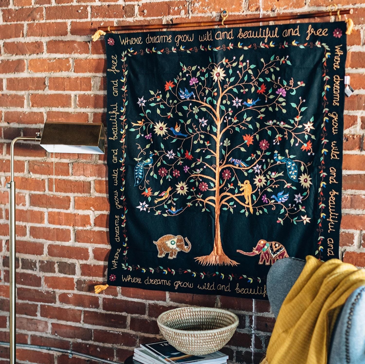 Whimsical Dream Tree Wall Hanging showcasing colorful hand-embroidered art in a nursery setting.