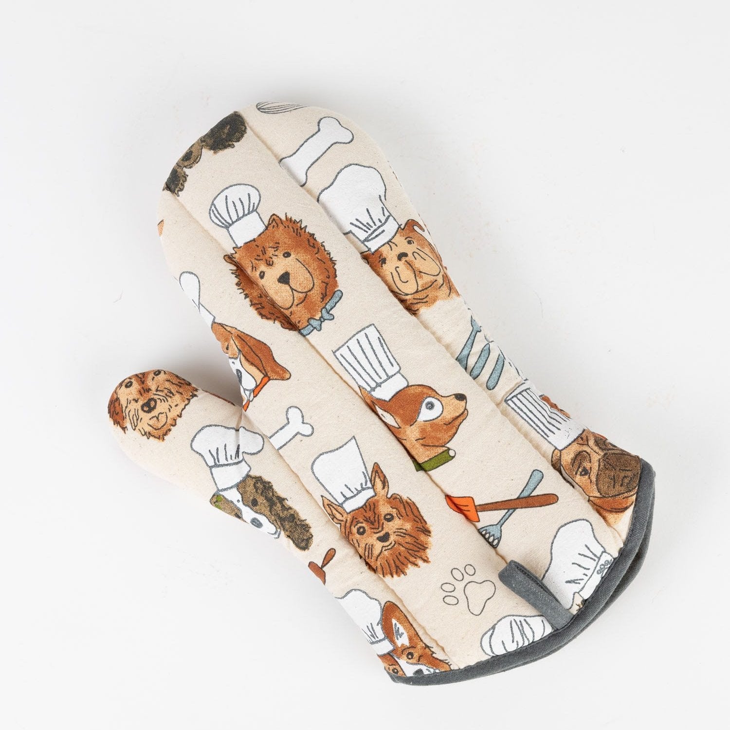Front view of a dog chef oven mitt with paw prints and bones, ideal for baking with dogs design