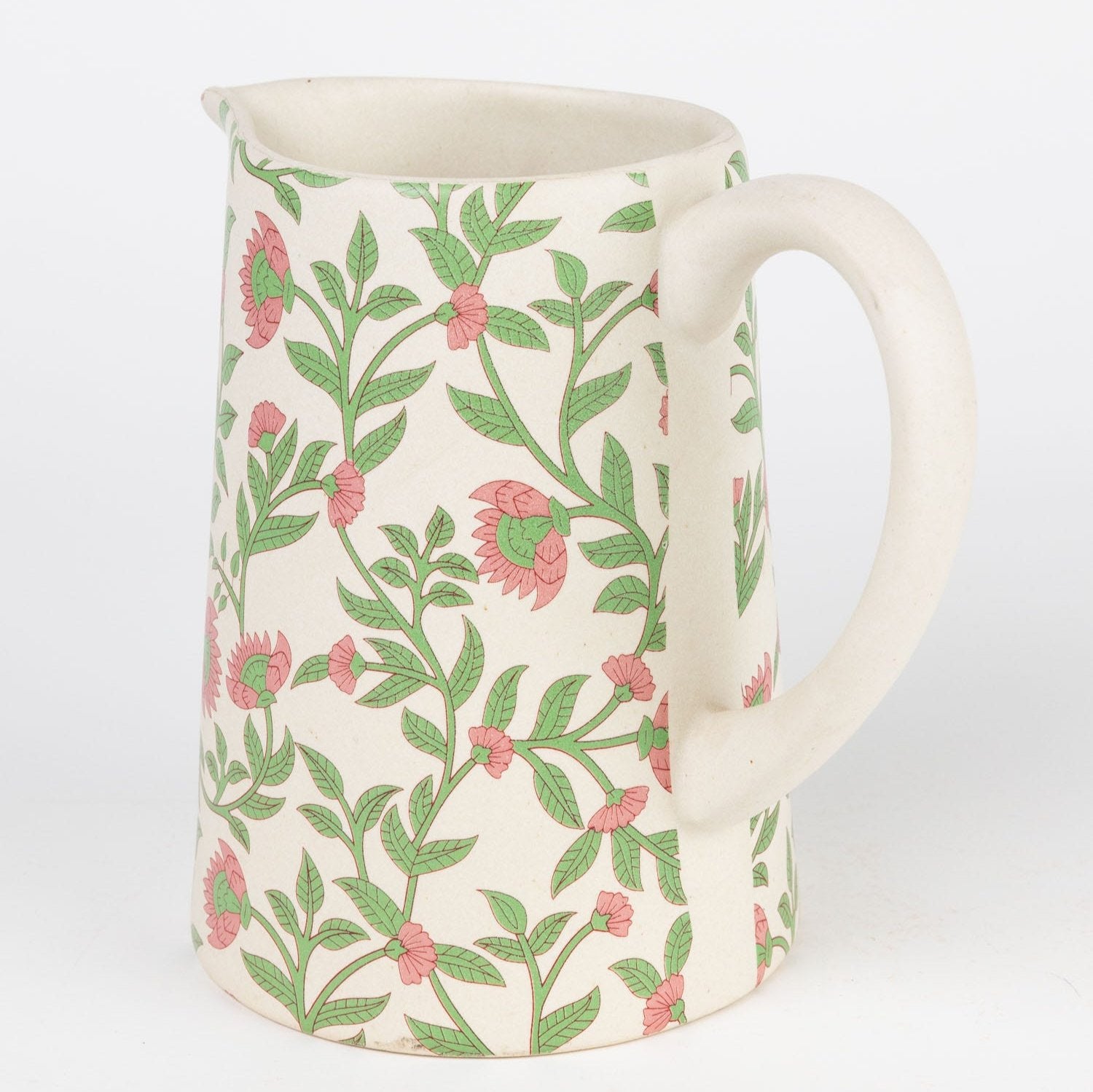 Blossoming Floral Ceramic Pitcher showcasing its vibrant floral design from an angle.