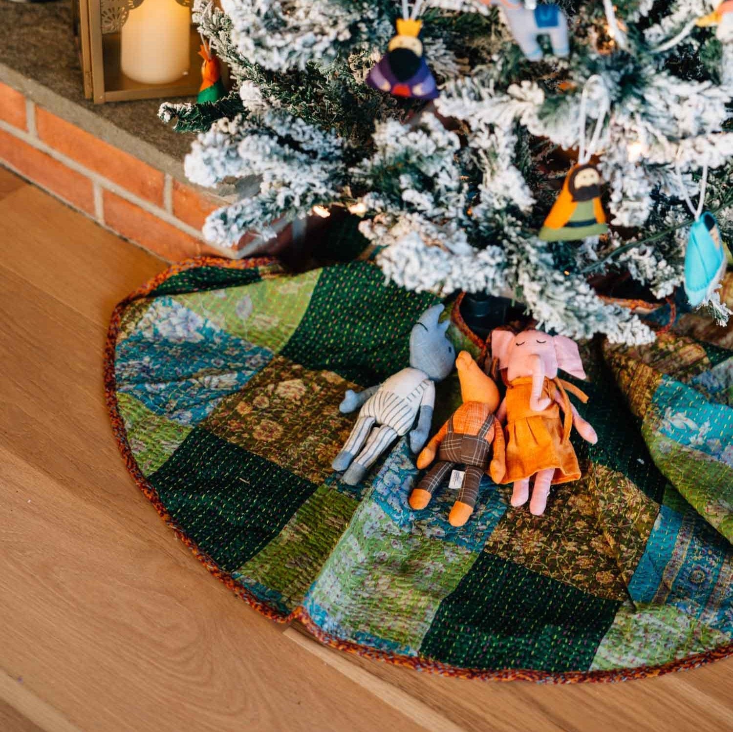 Artisan Kantha stitched tree skirt showcasing vibrant colors and unique patterns, ideal for holiday decor.