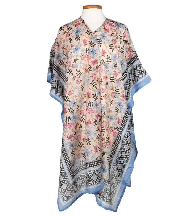 Breezy floral cover-up layered over a white tank at the beach