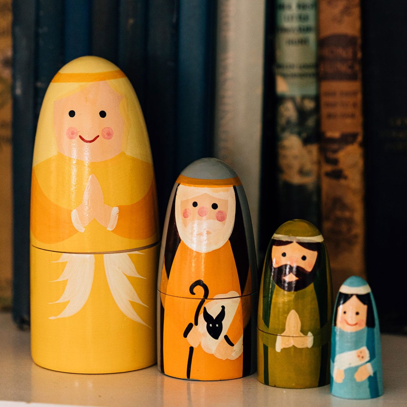 Close-up of artisan milkwood nativity nesting doll showing detailed craftsmanship