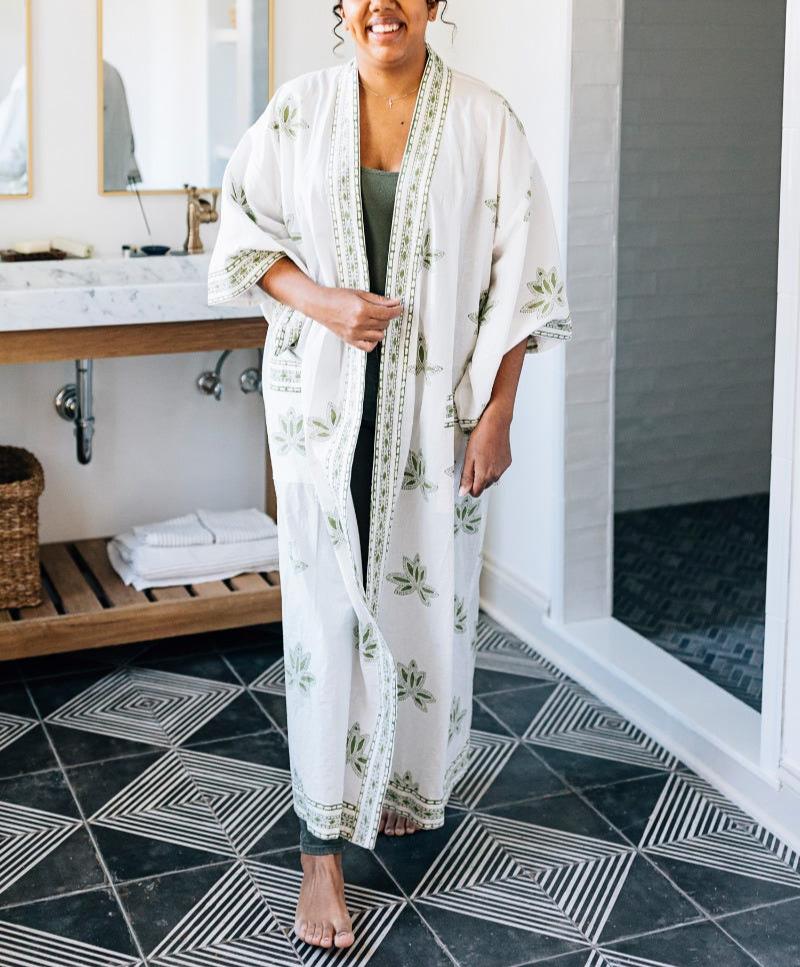 Close-up of green lotus pattern on handcrafted cotton bathrobe