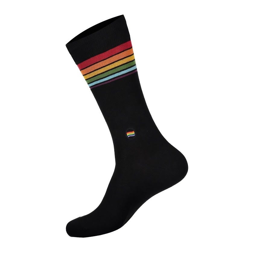 Close-up of rainbow stripes on organic cotton socks supporting LGBTQ community