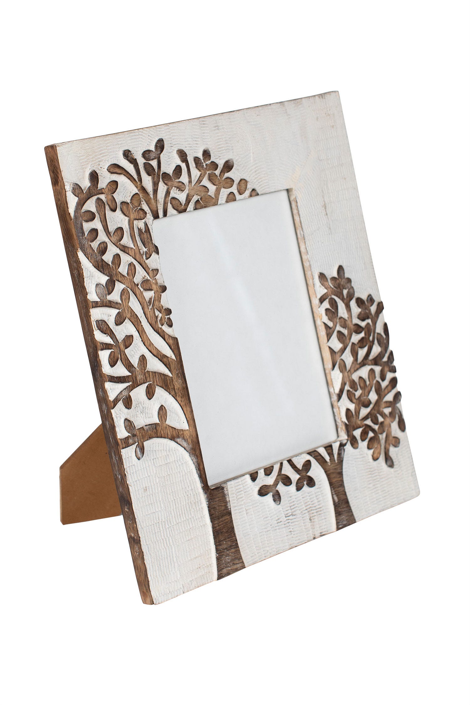 Close-up of carved mango wood tree design on the photo frame